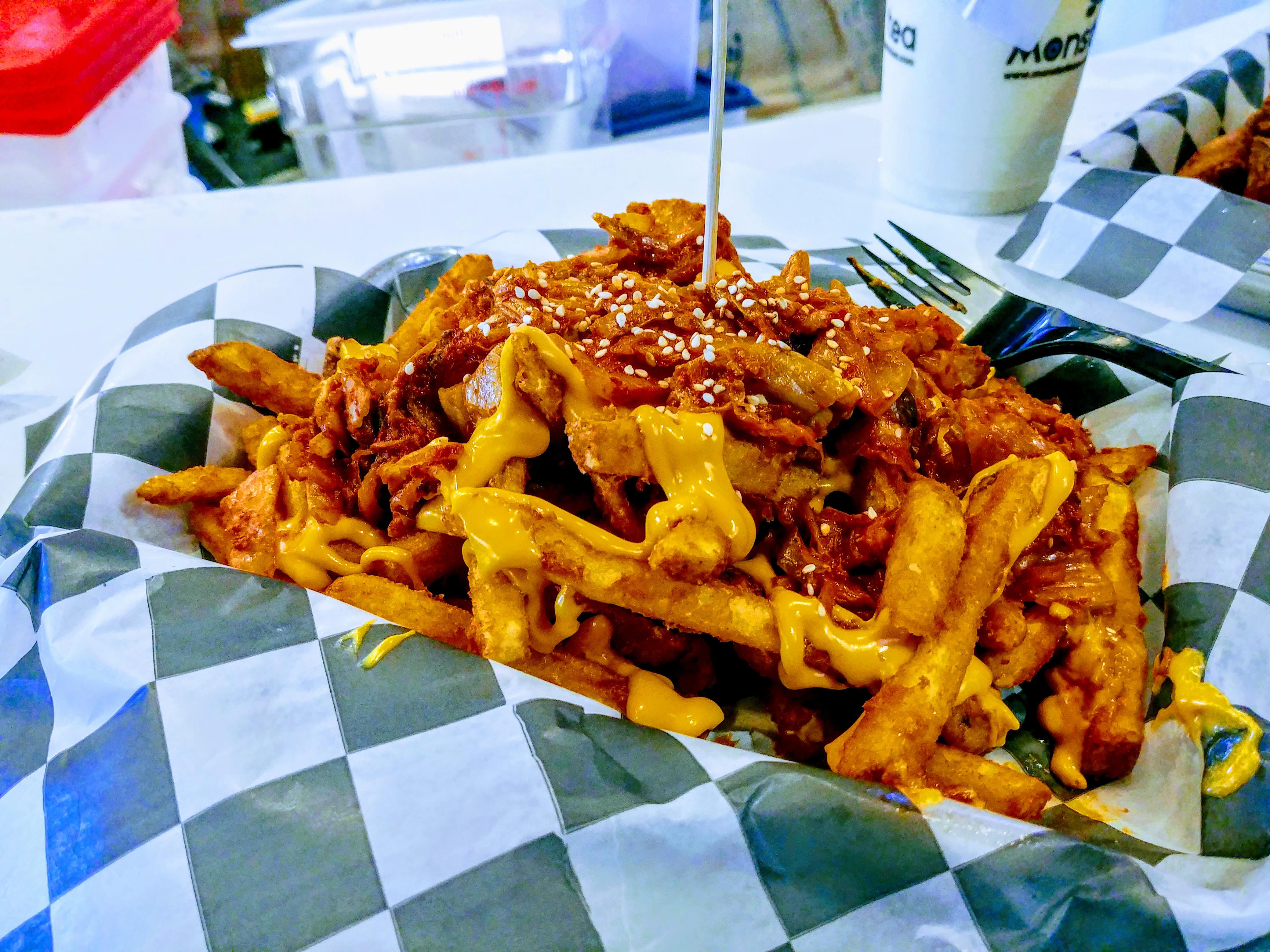 Kimchee Cheddar cheese fries. Surprisingly spicy. r/spicy