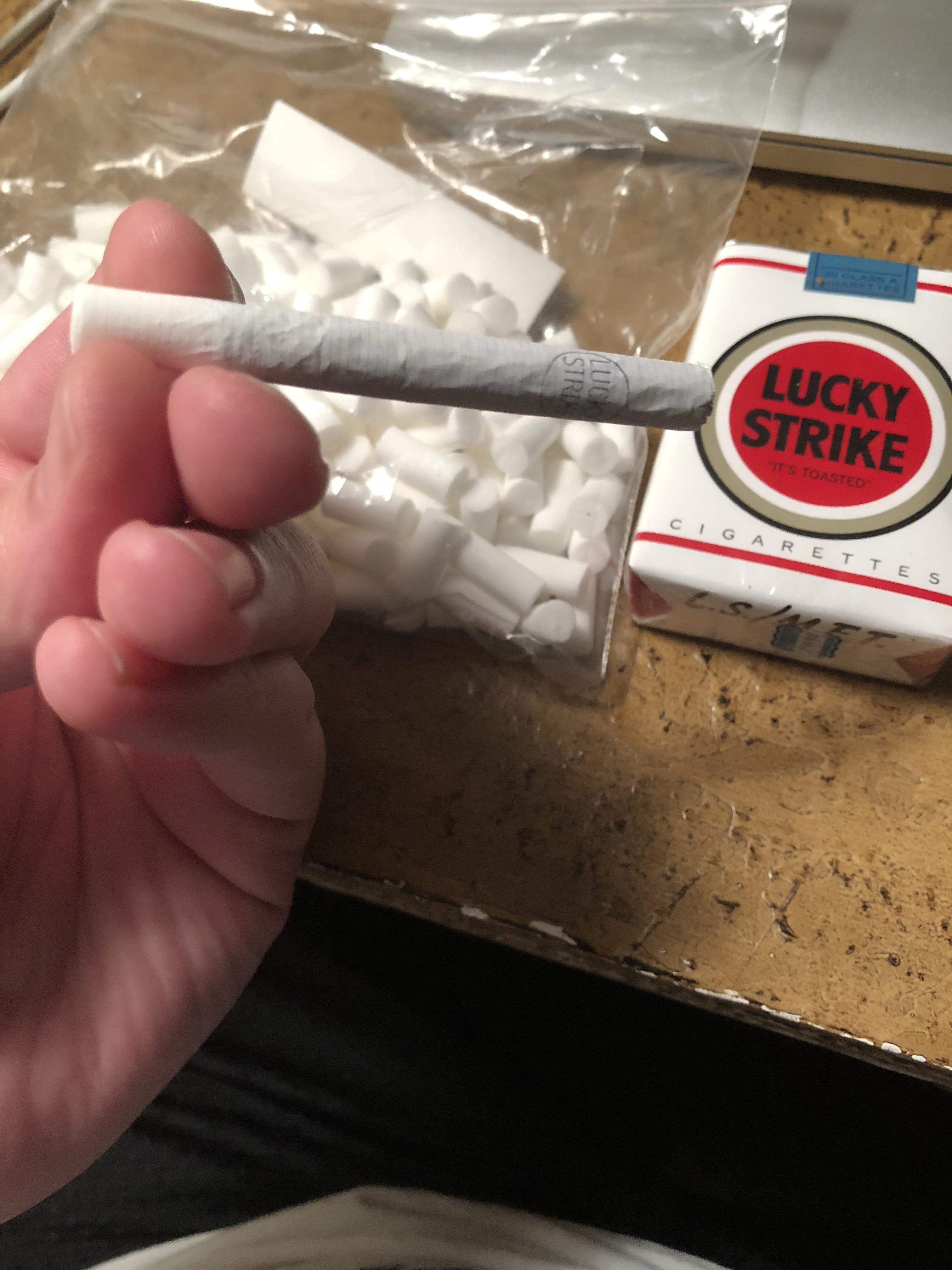 DIY Lucky Strike Filters. Super easy to do. Just roll some tobacco out of one end and insert the