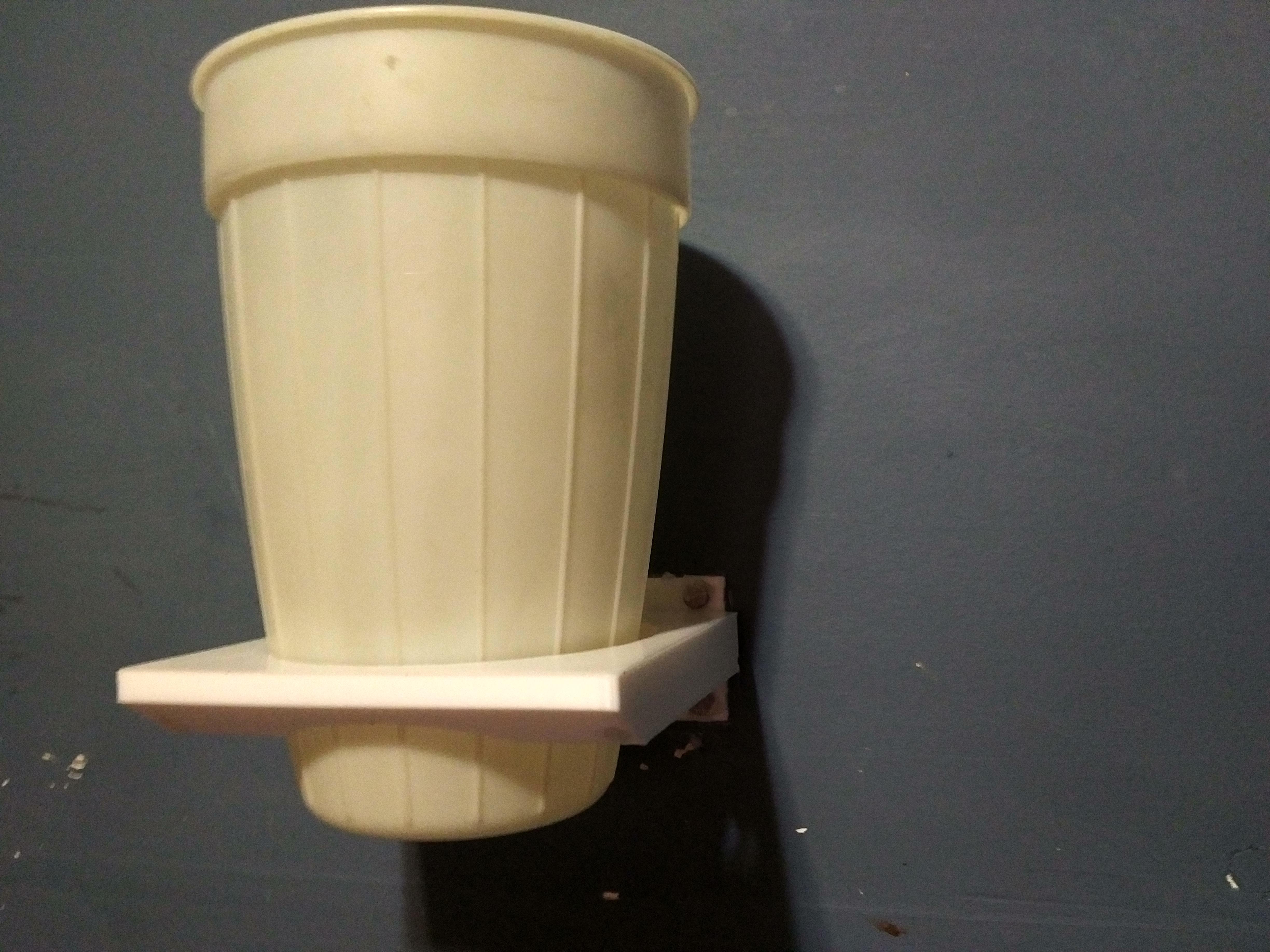 Moved my room around but had to move my bedside table, so i made a wall mounted cup holder to