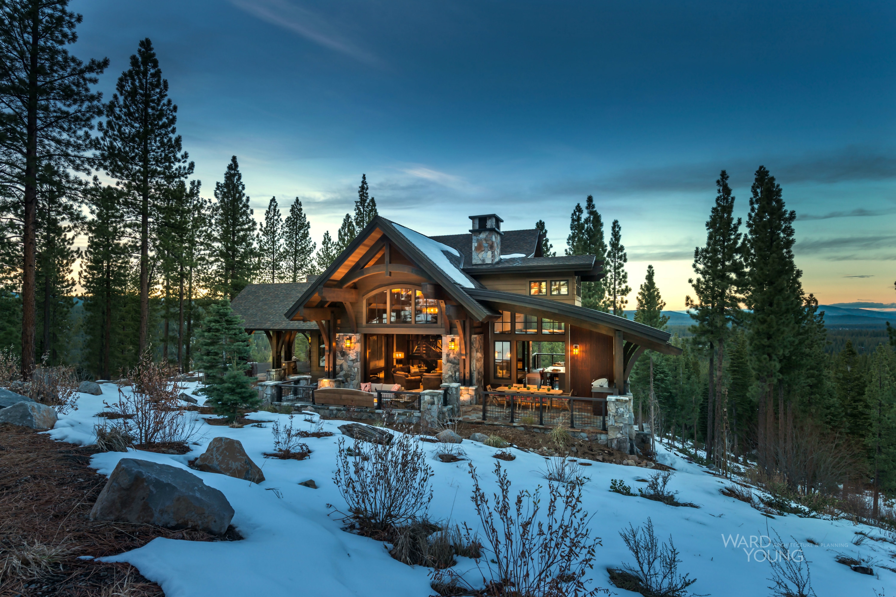 Mountain lodge on a steep site designed to provide views