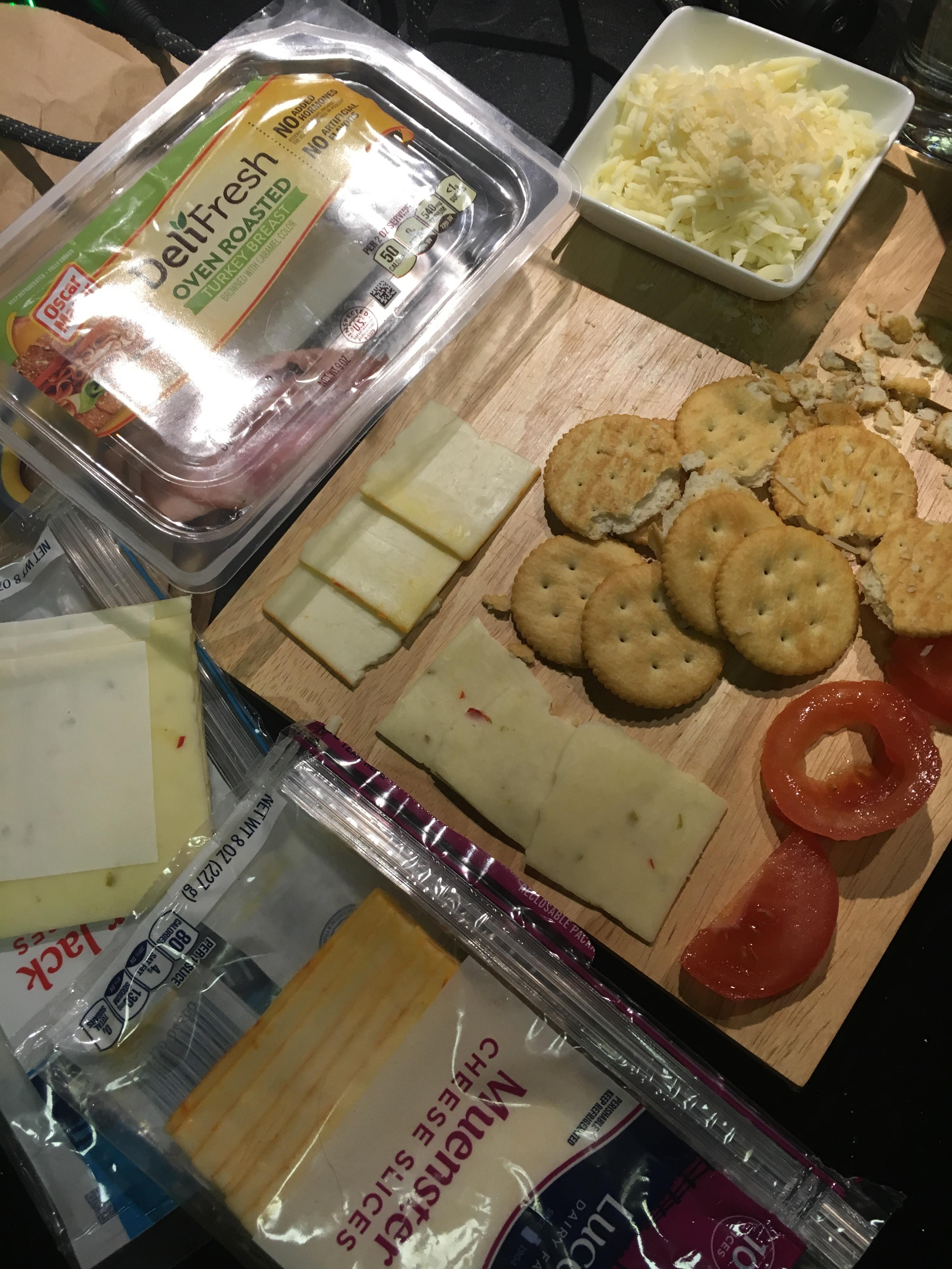Cheeseboard with Ritz Crackers, Tomatoes, Oven Roasted Turkey Breast