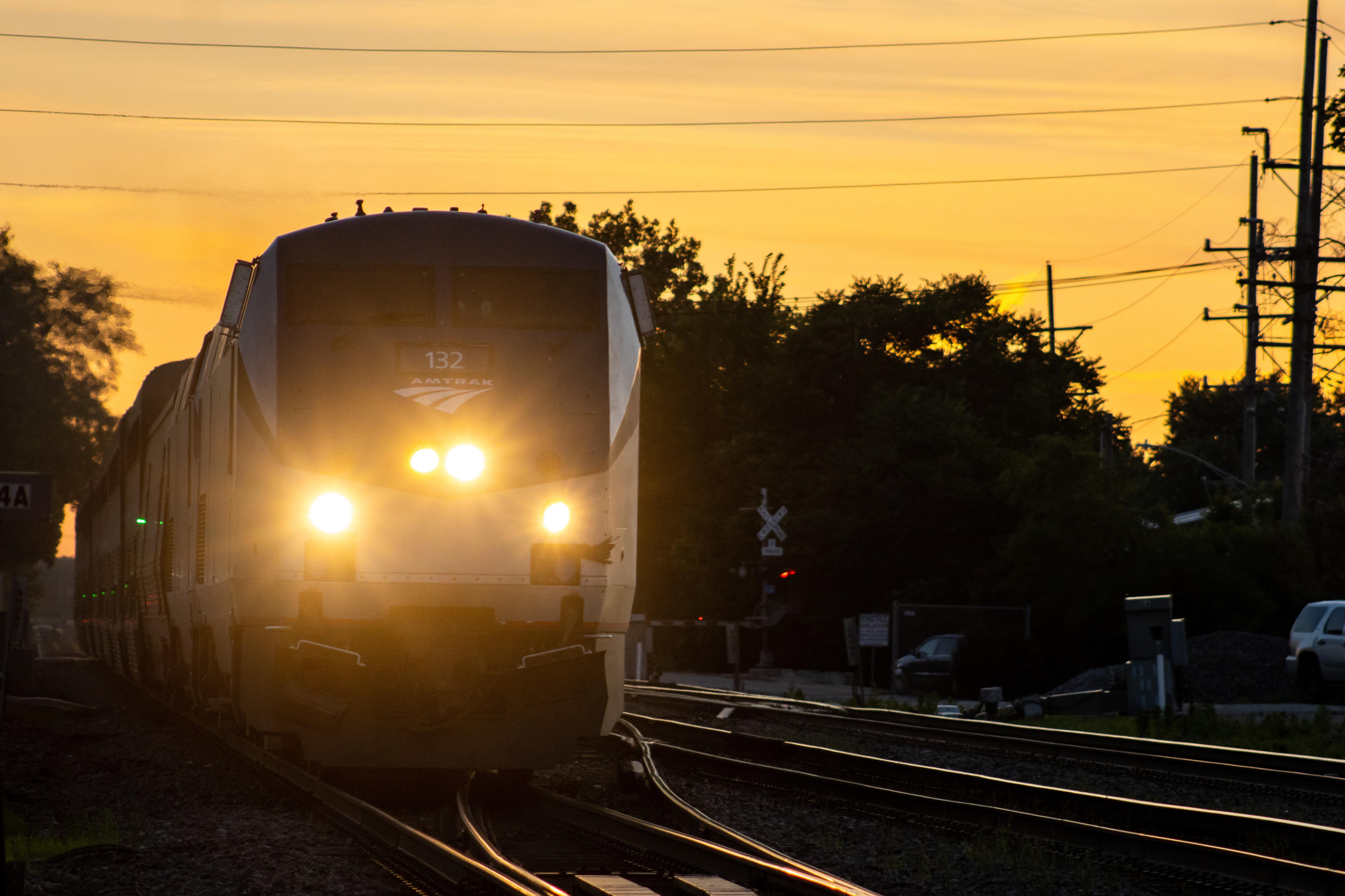 Headlights at sunset trains