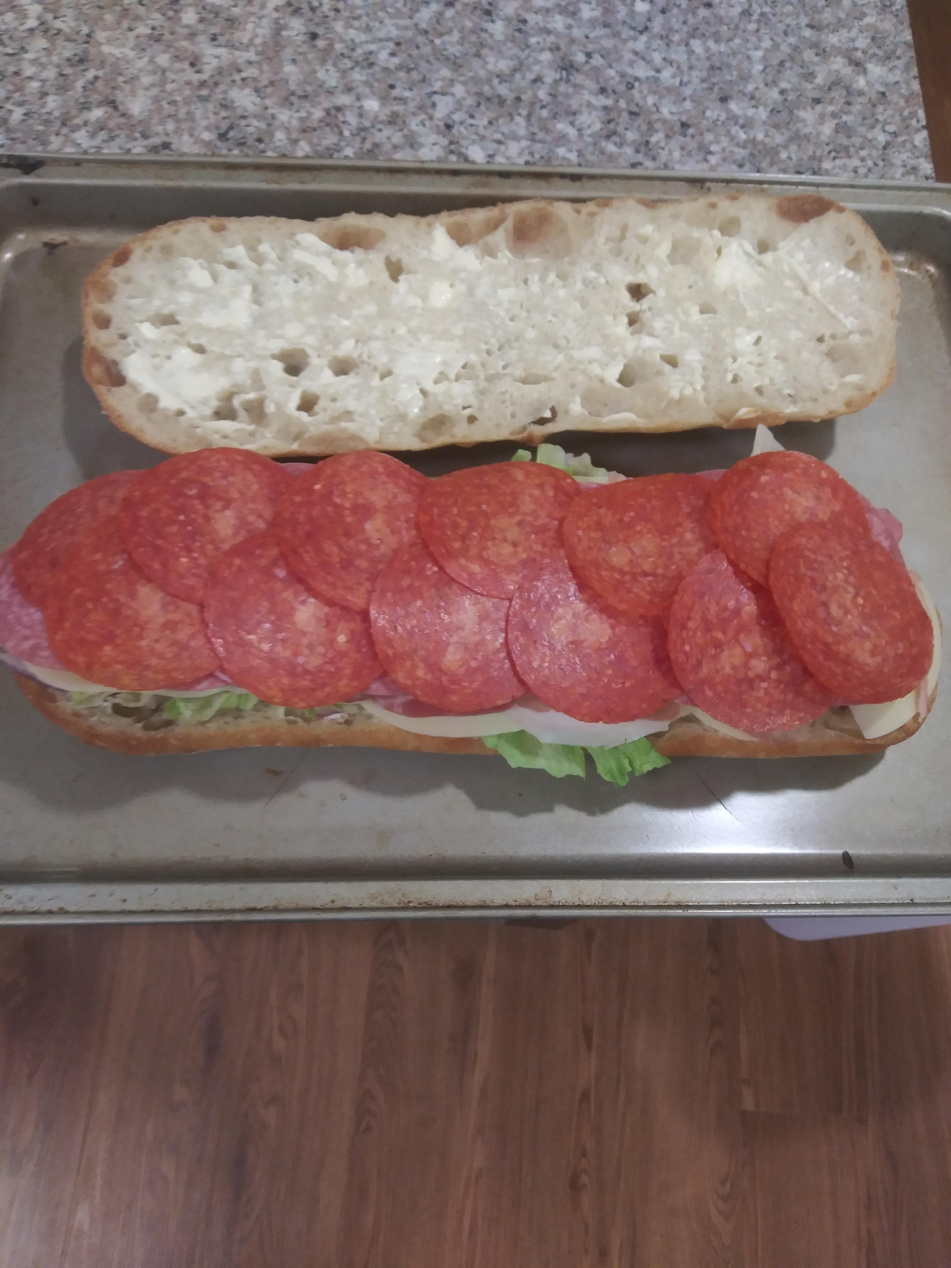 Ham, prosciutto, salami, pepperoni, provolone, lettuce, onion, and mayo