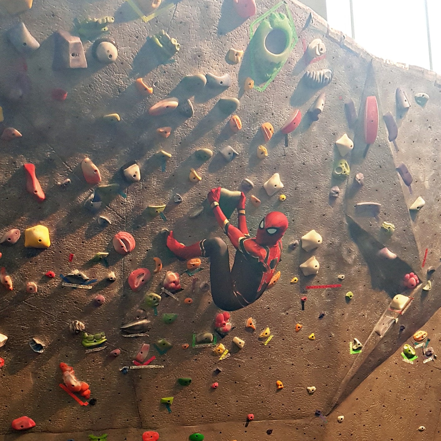 There was guy dressed as Spiderman climbing the bouldering wall in