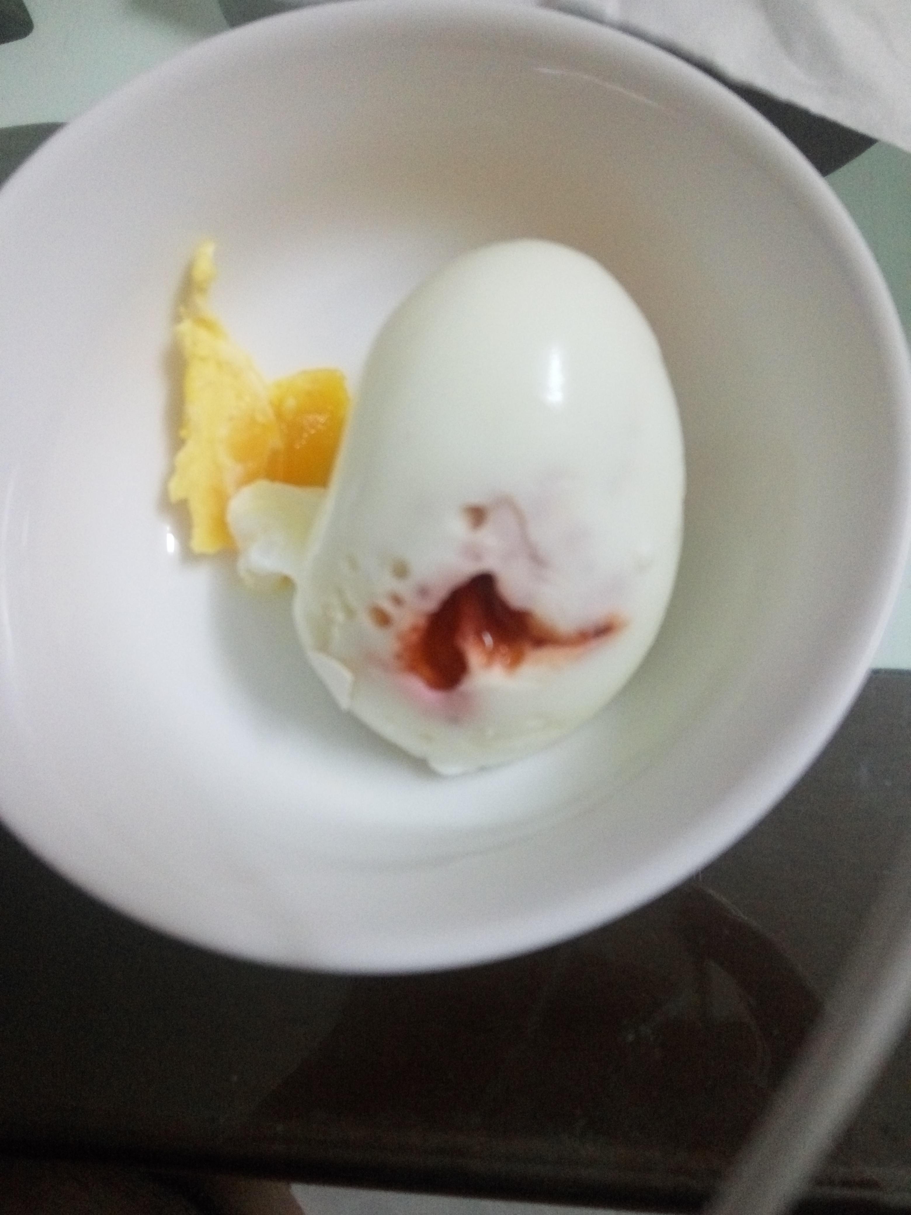 I was bored so I poked a hole in a raw egg, filled some ketchup in and