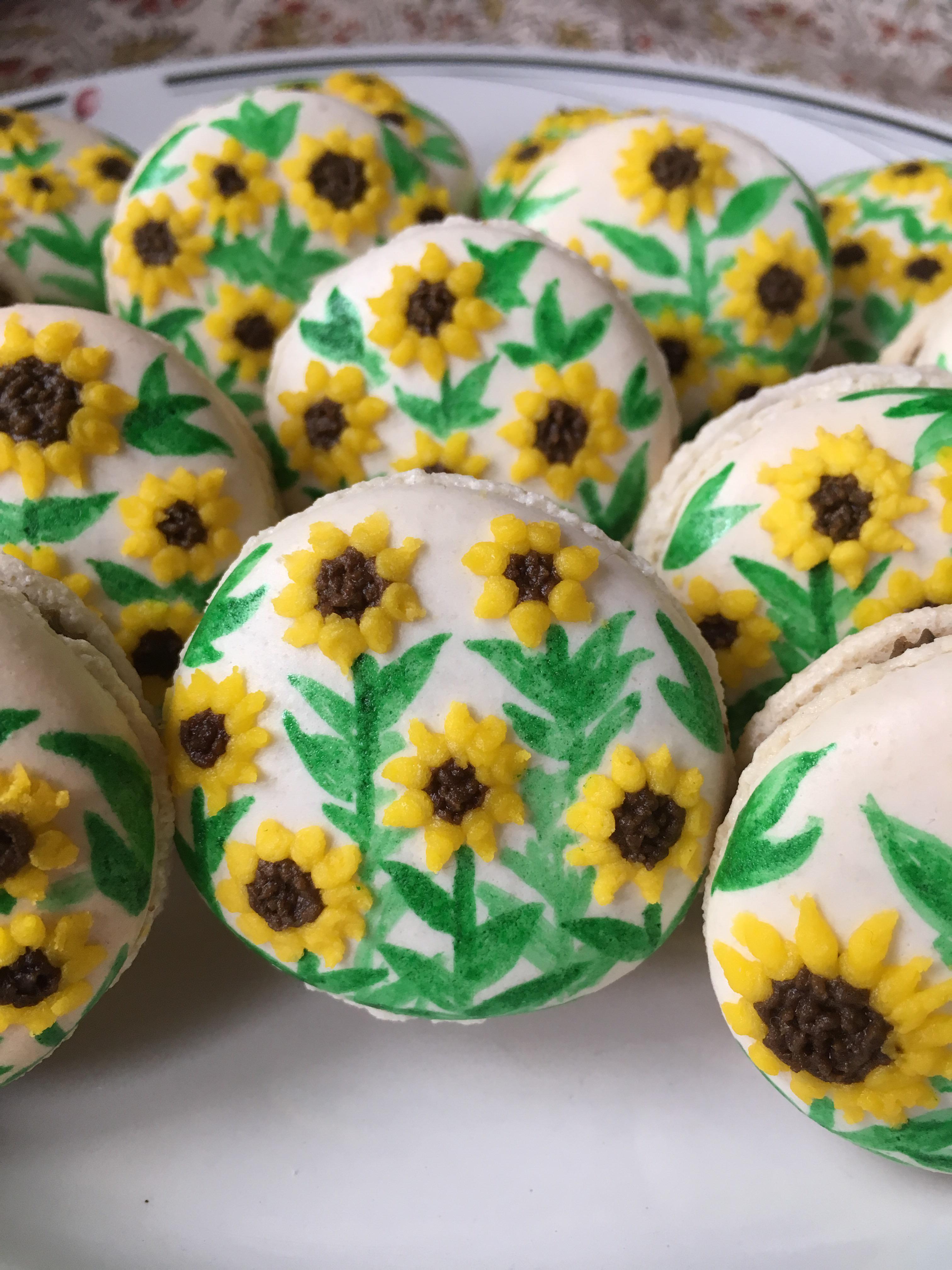 Baked a whole field of sunflower macarons! (Chocolate filling with