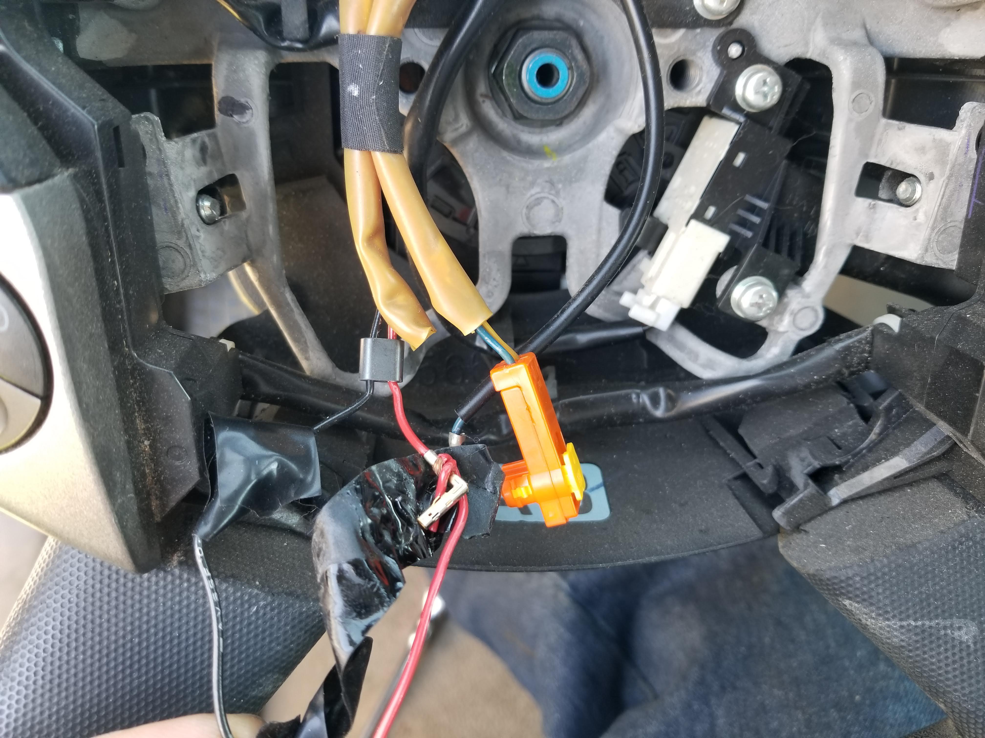 Airbag light came on. Upon inspection, found this (yes that is bare