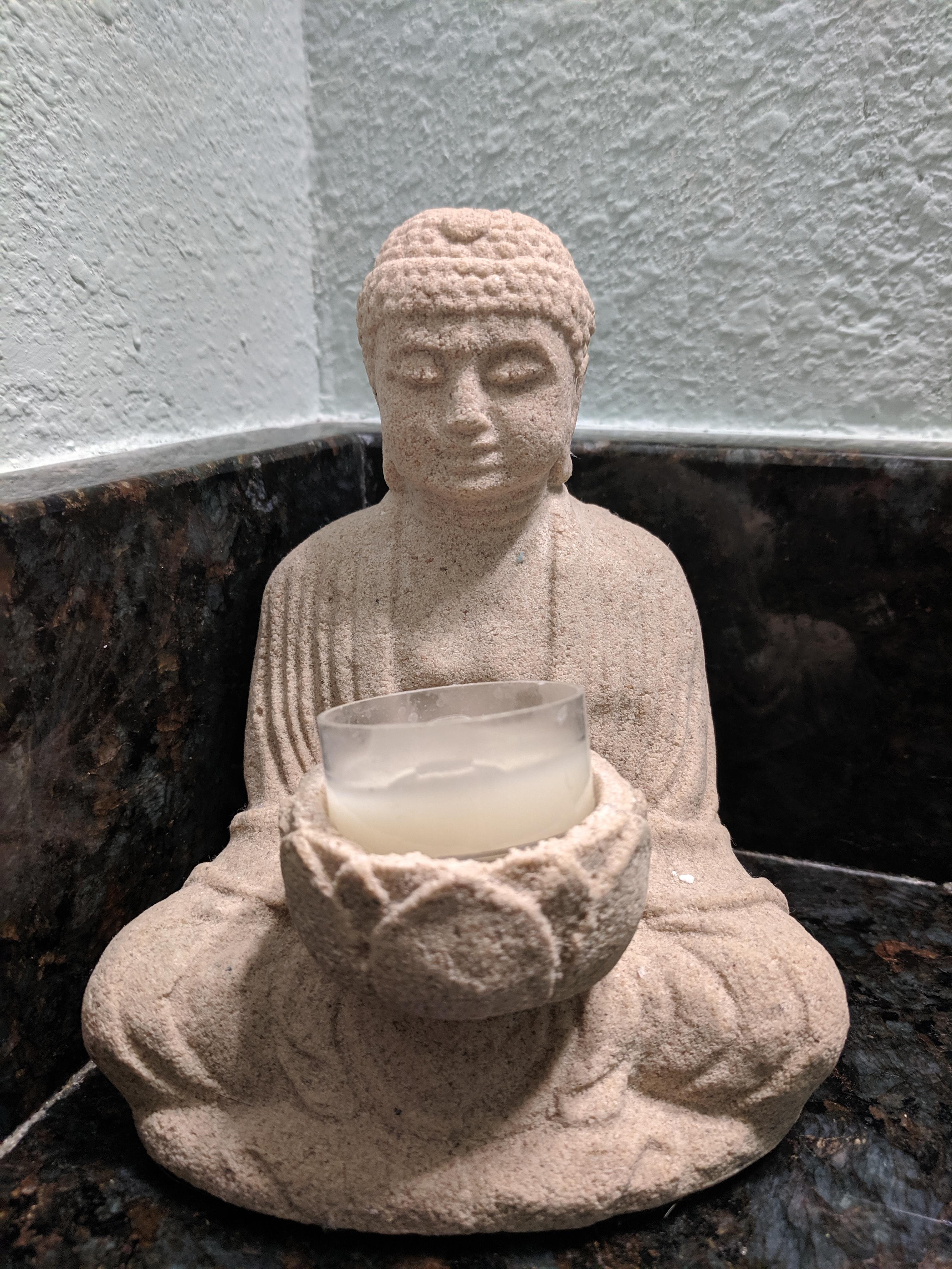 This mini statue is my uncles bathroom. I think it might be Buddhist