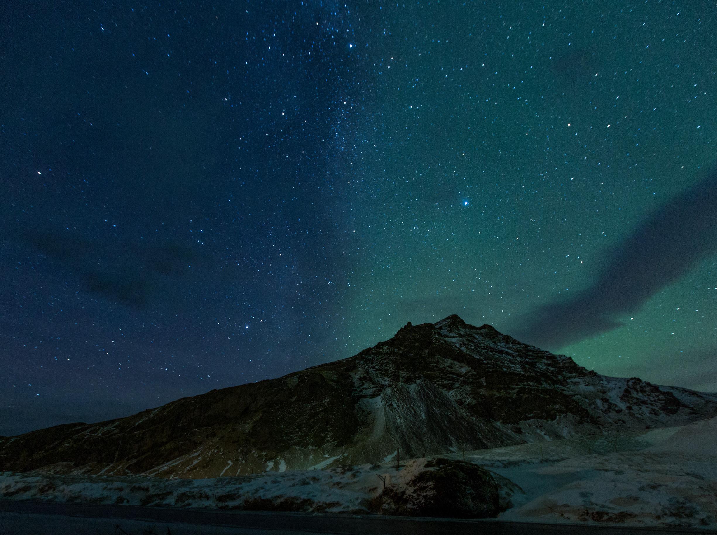 The sky split in half over a mountain in Iceland The sky split in half over a mountain in Iceland