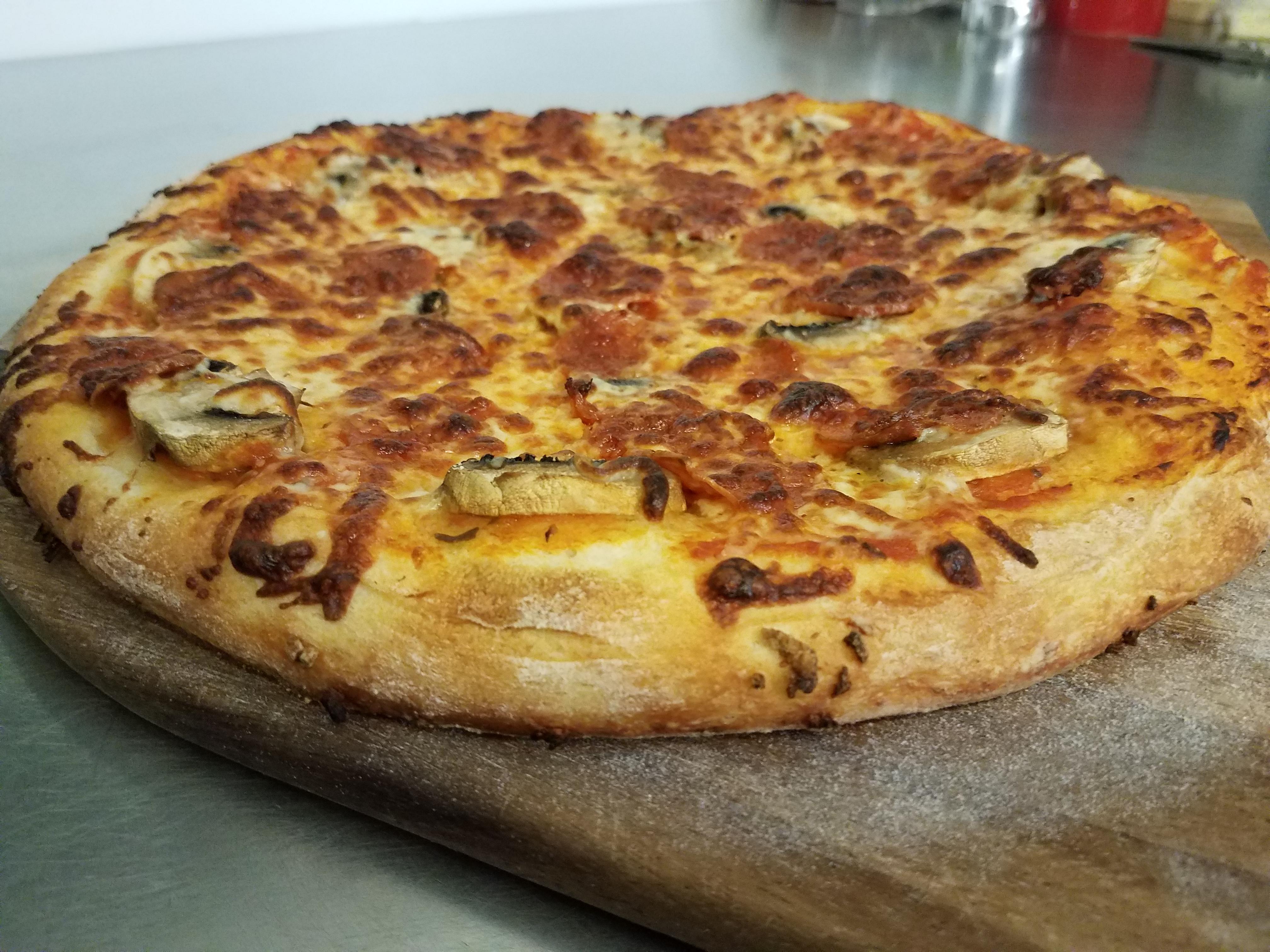Pepperoni and mushrooms on Tiseo's dough Pizza
