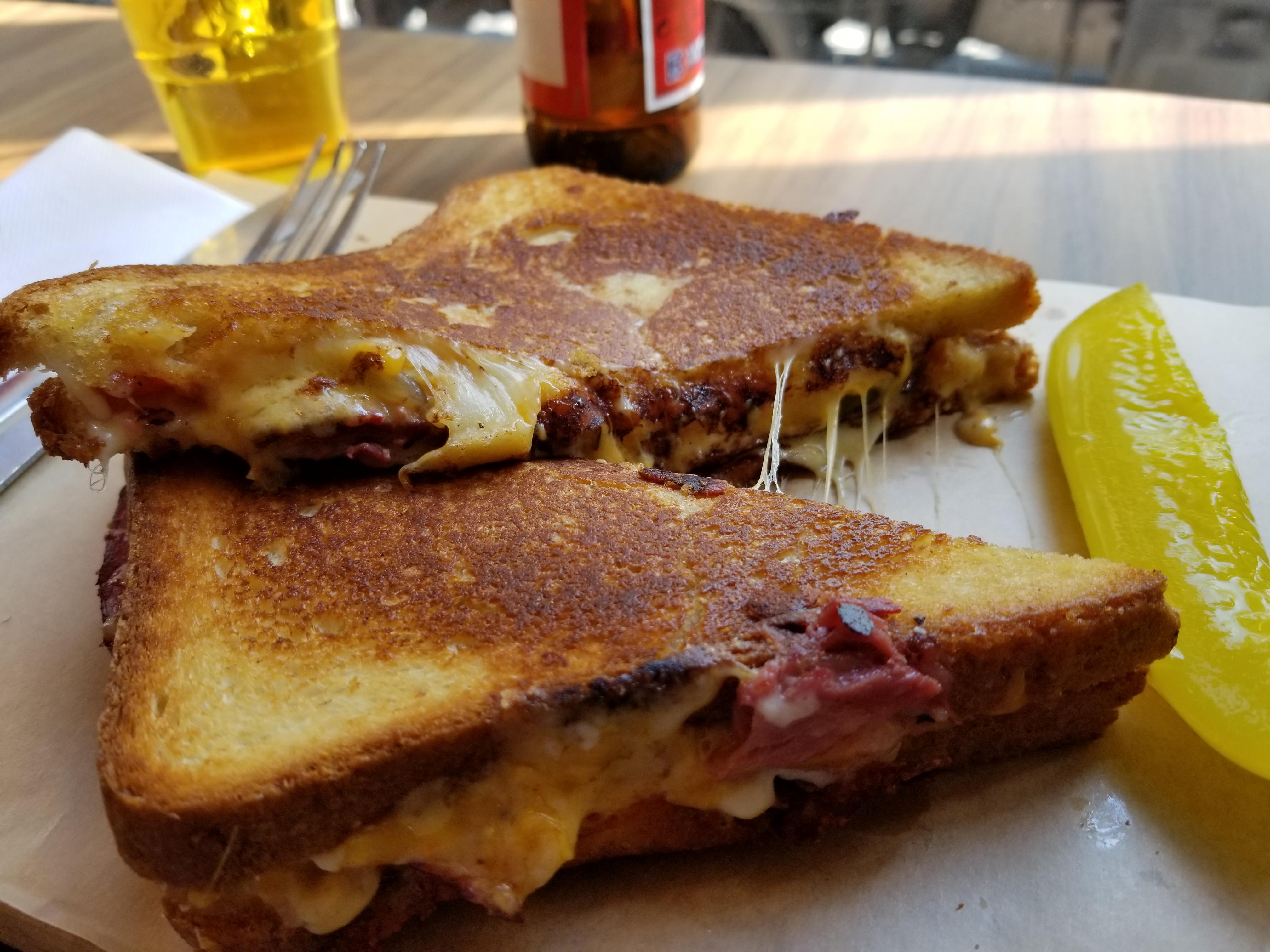 Pastrami with cheddar, swiss, pickles, honey mustard, and tomatoe sauce