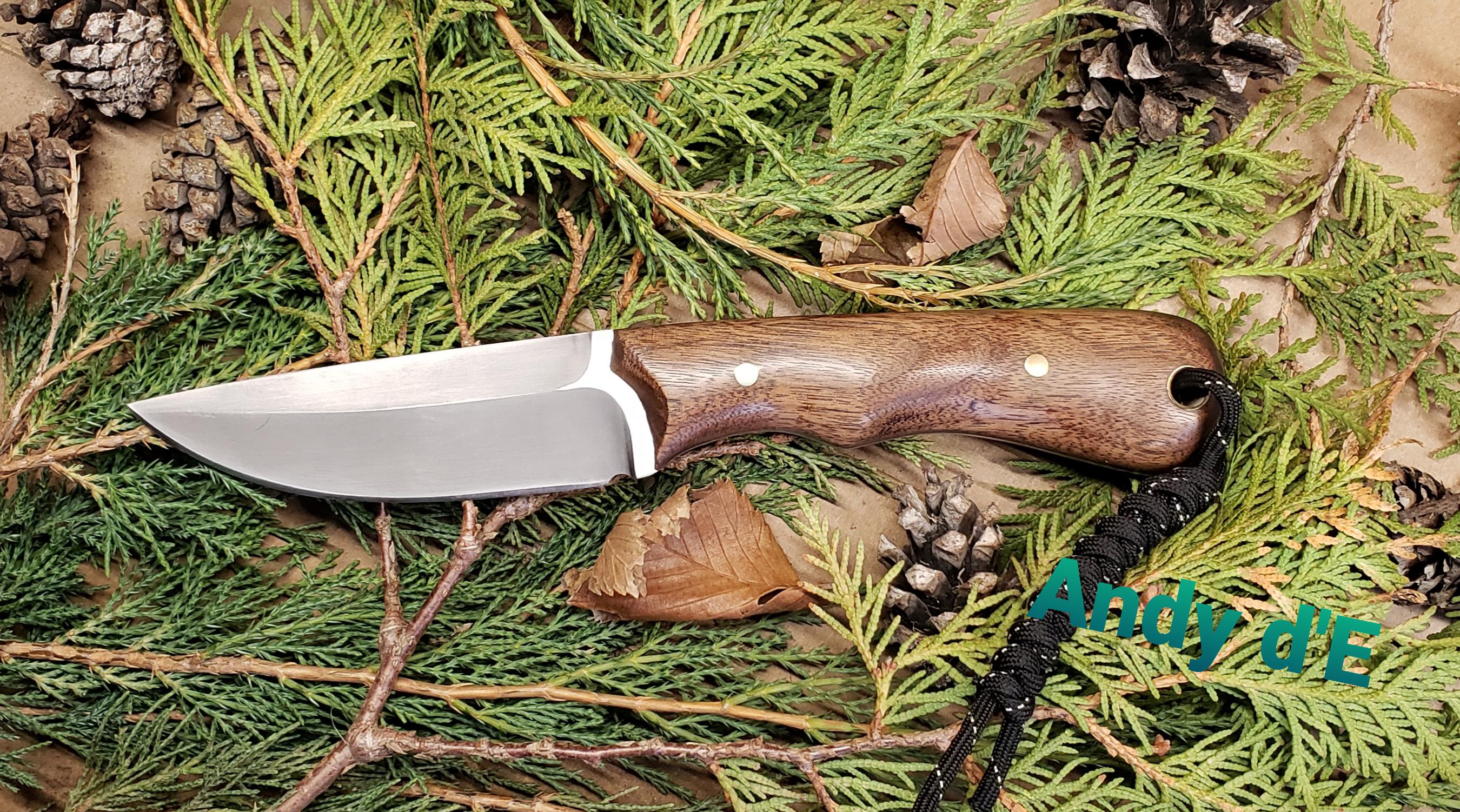 Simple camp knife with walnut scales. Tried a new hollow ground false