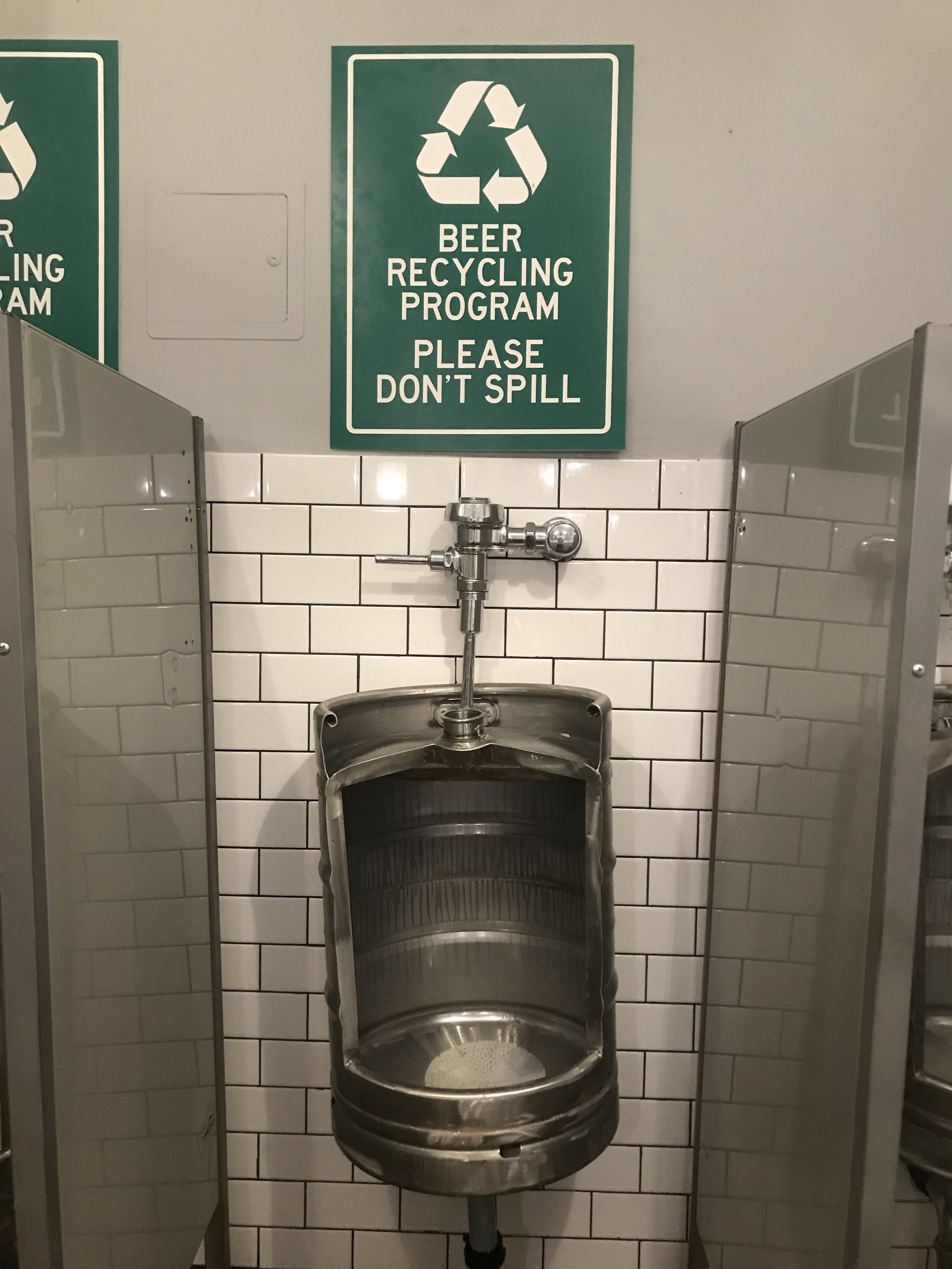 Recycled kegs for recycling beer in a sports bar bathroom r