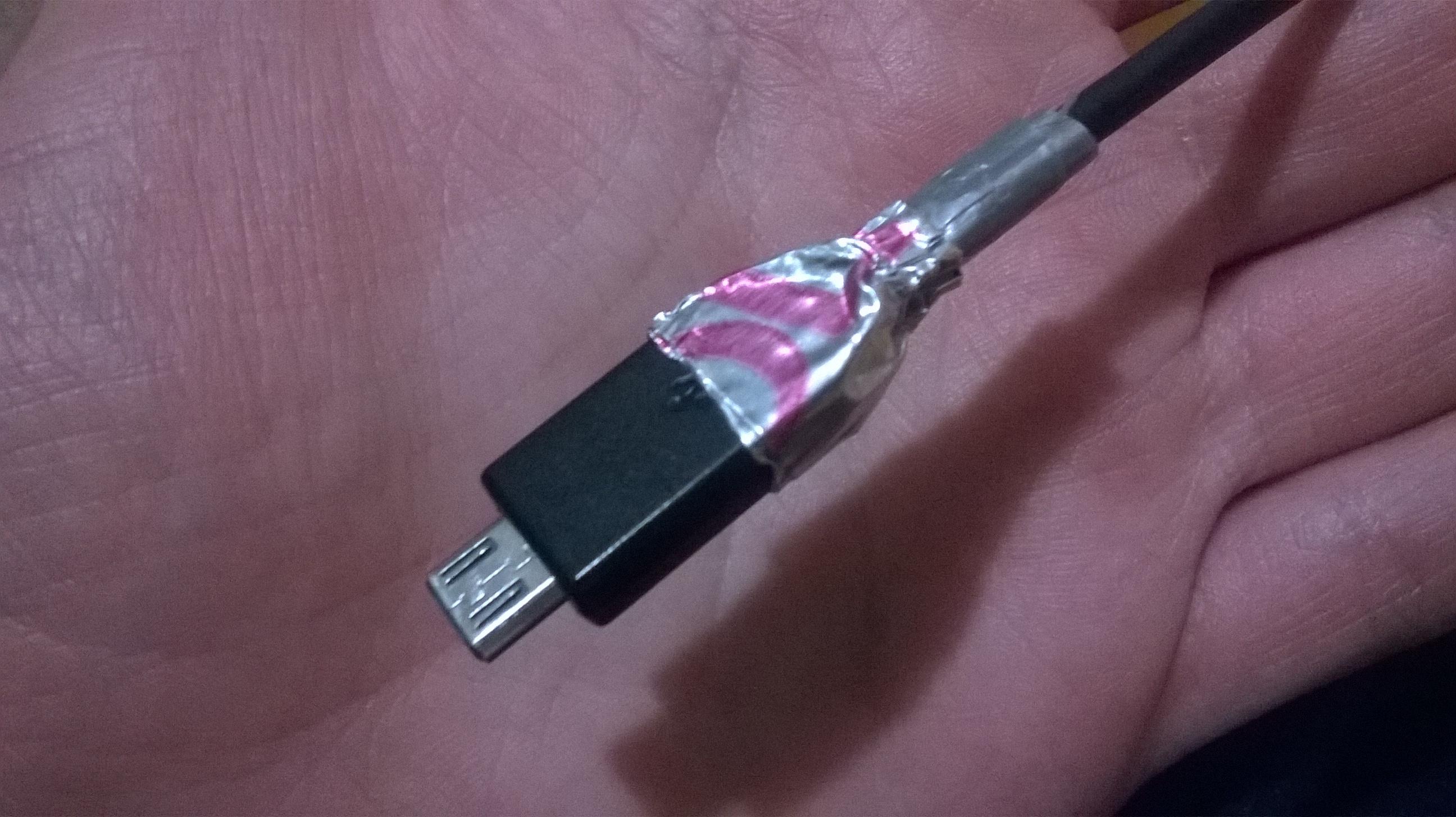 (Small) Charger cable broke, so I wrapped it in duct tape, then again