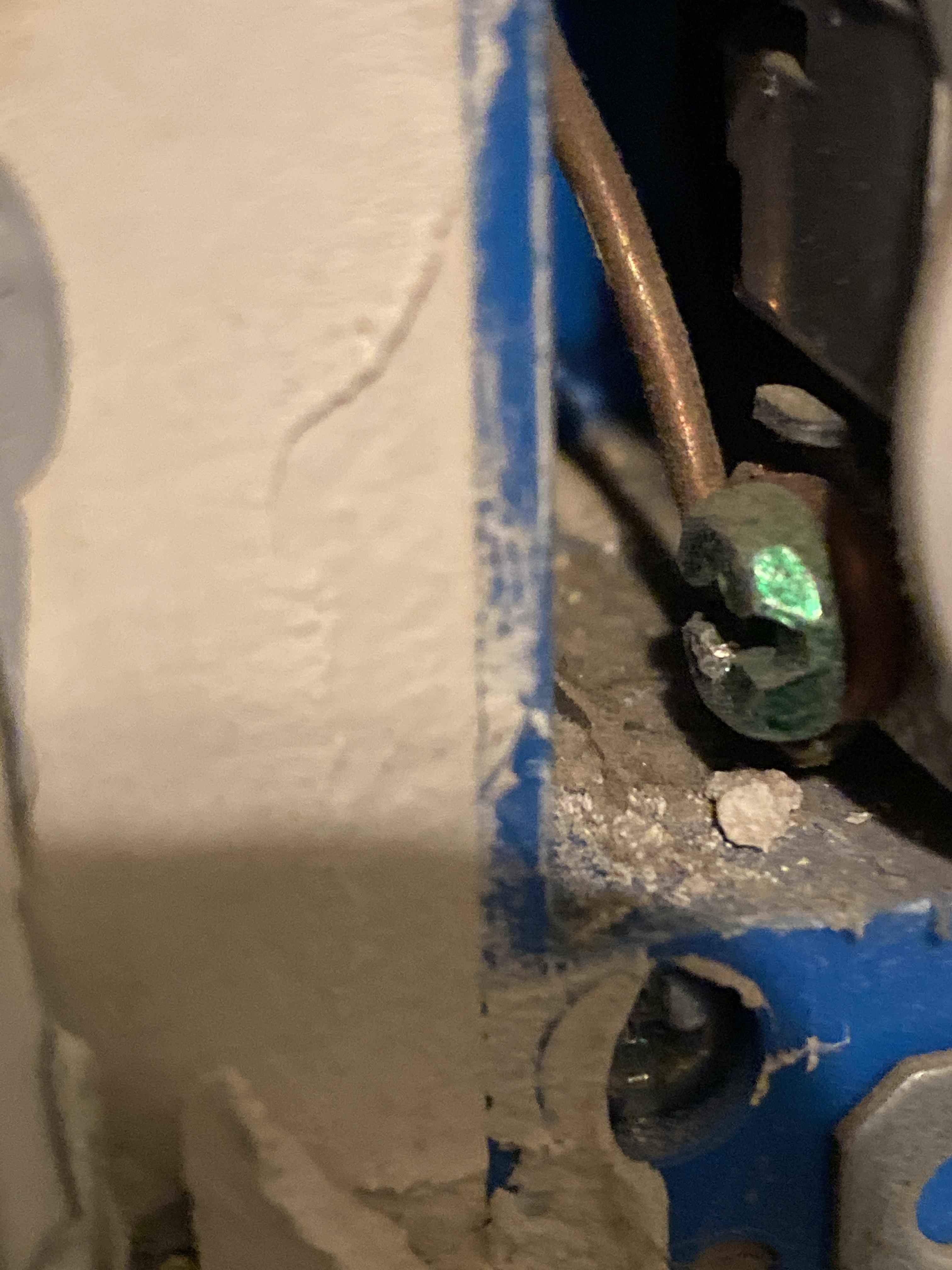 Ground wire seems to be attached at receptacle, but surge protector shows ungrounded. Also