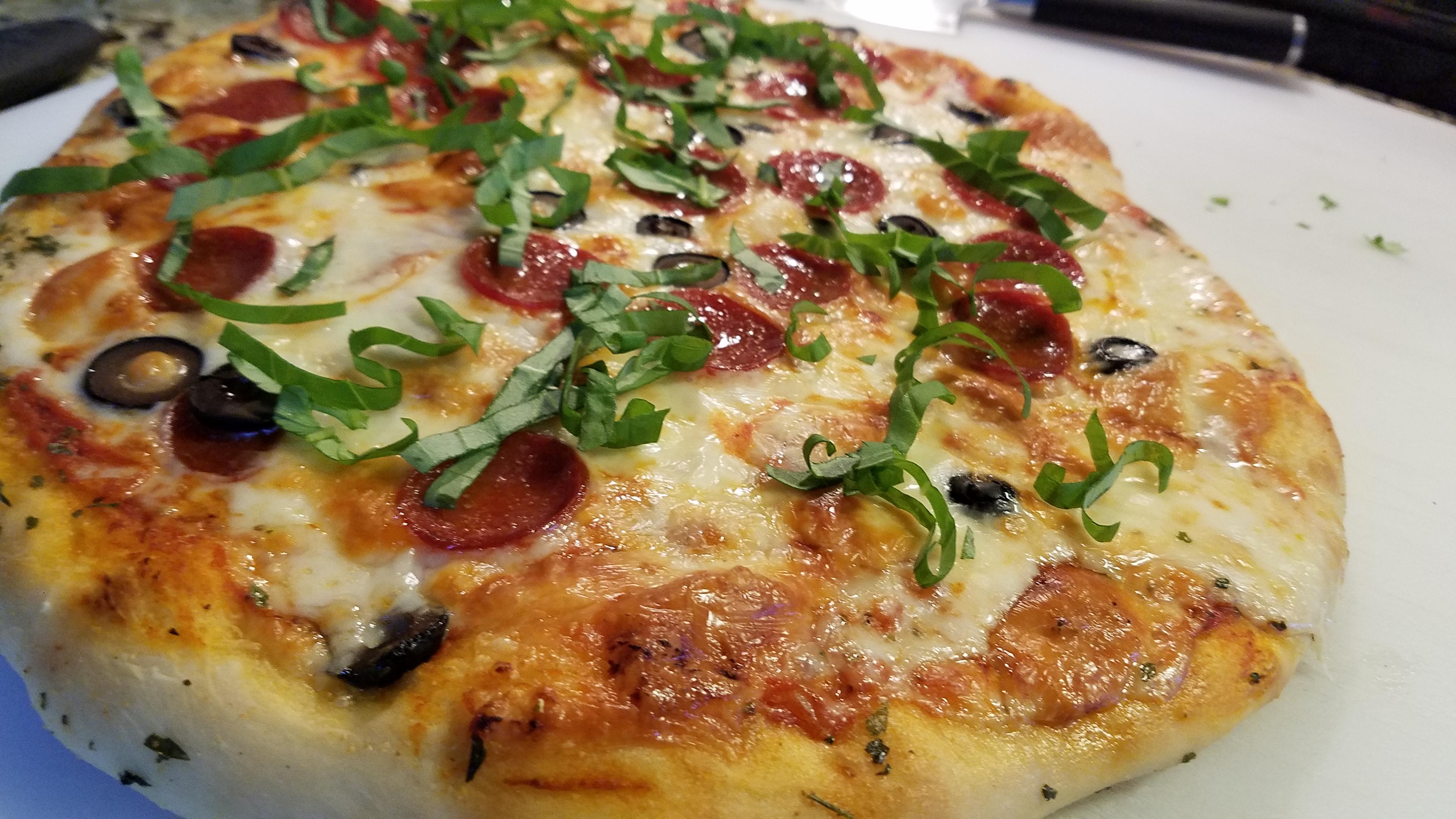 [Homemade] Pizza with herb butter crust and fresh basil! r/Pizza