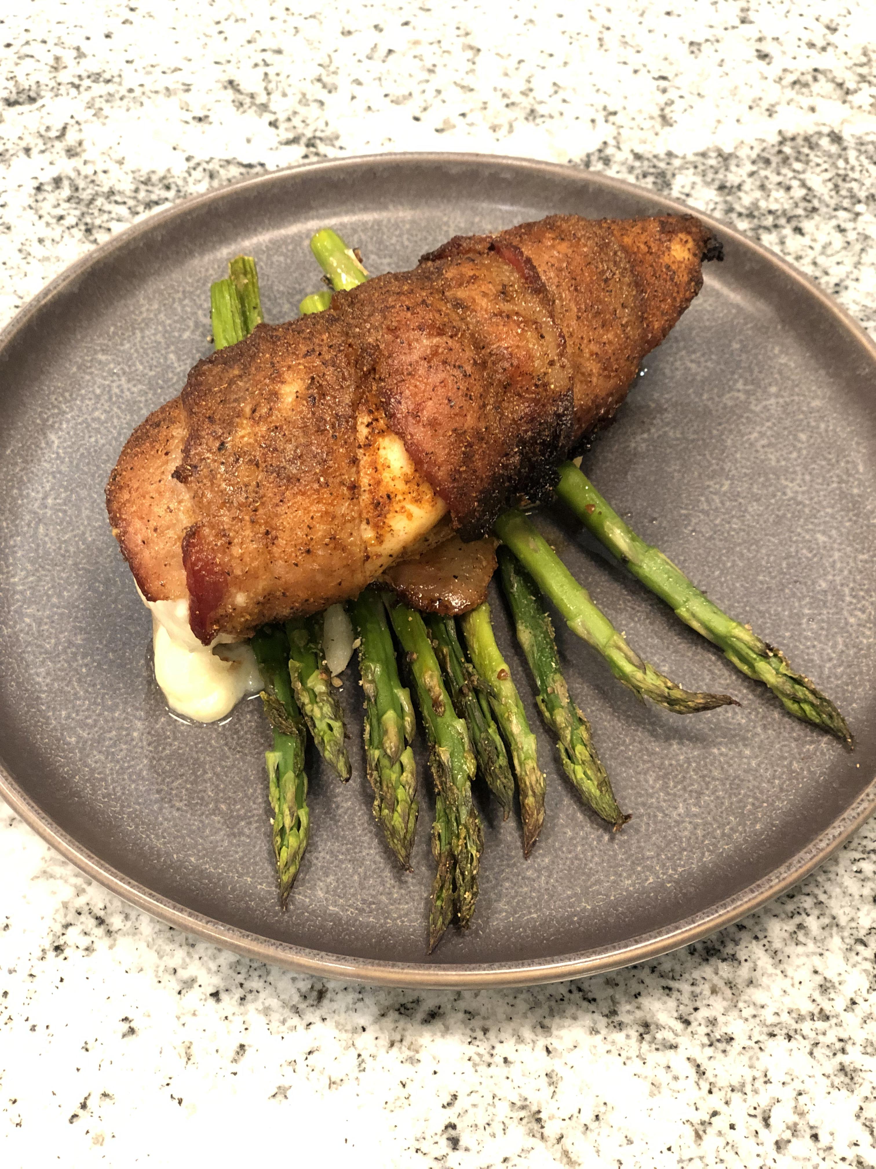 Bacon Wrapped chicken breast stuffed with pepper jack cheese. Rubbed