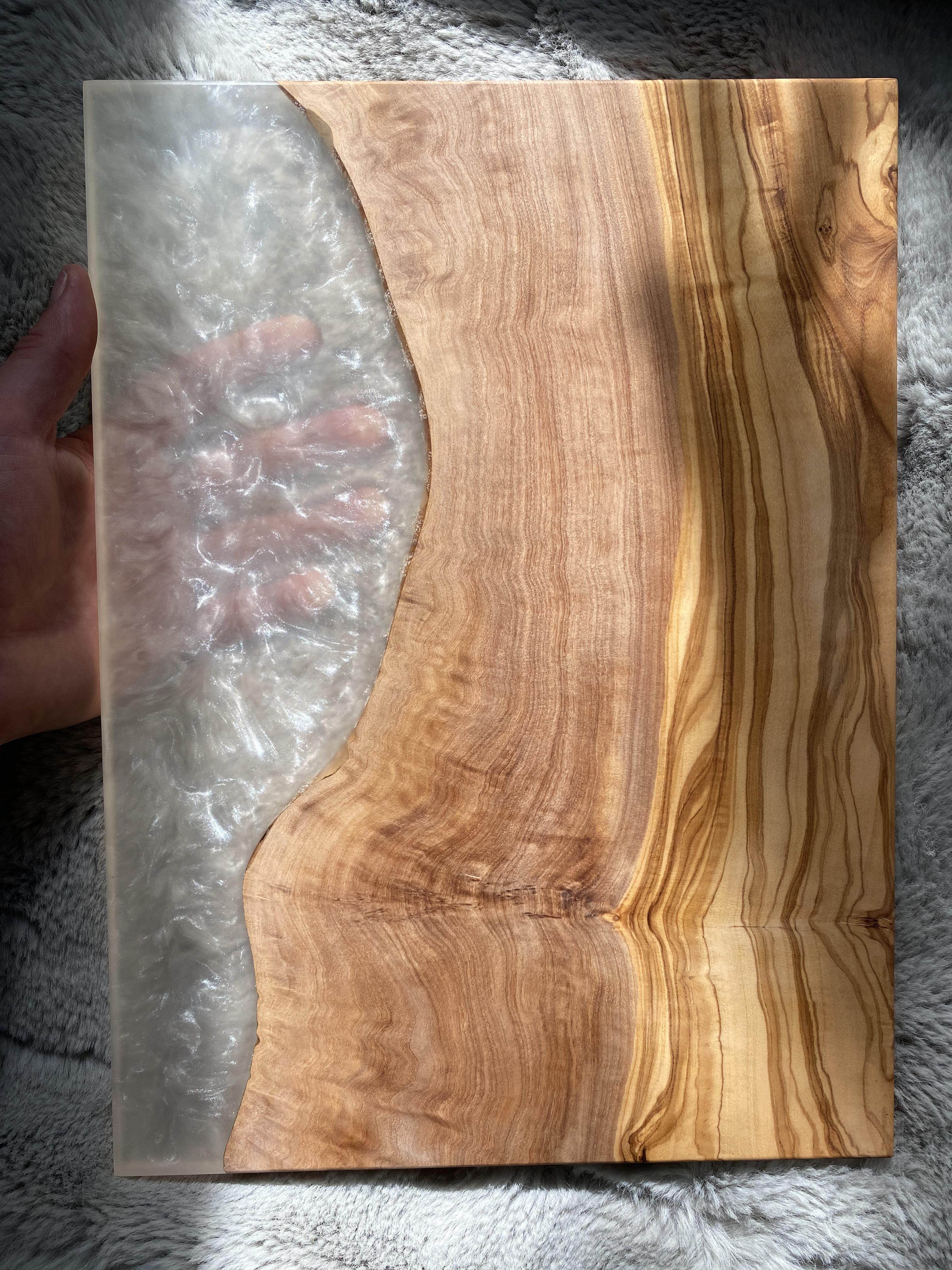 A custom charcuterie board I made using Olive wood with Arctic Pearl