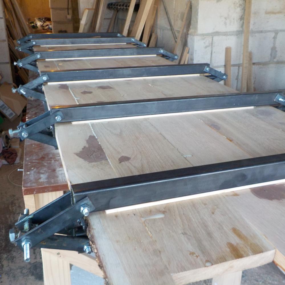 I made these panel clamps to help me glue up large panels with easy