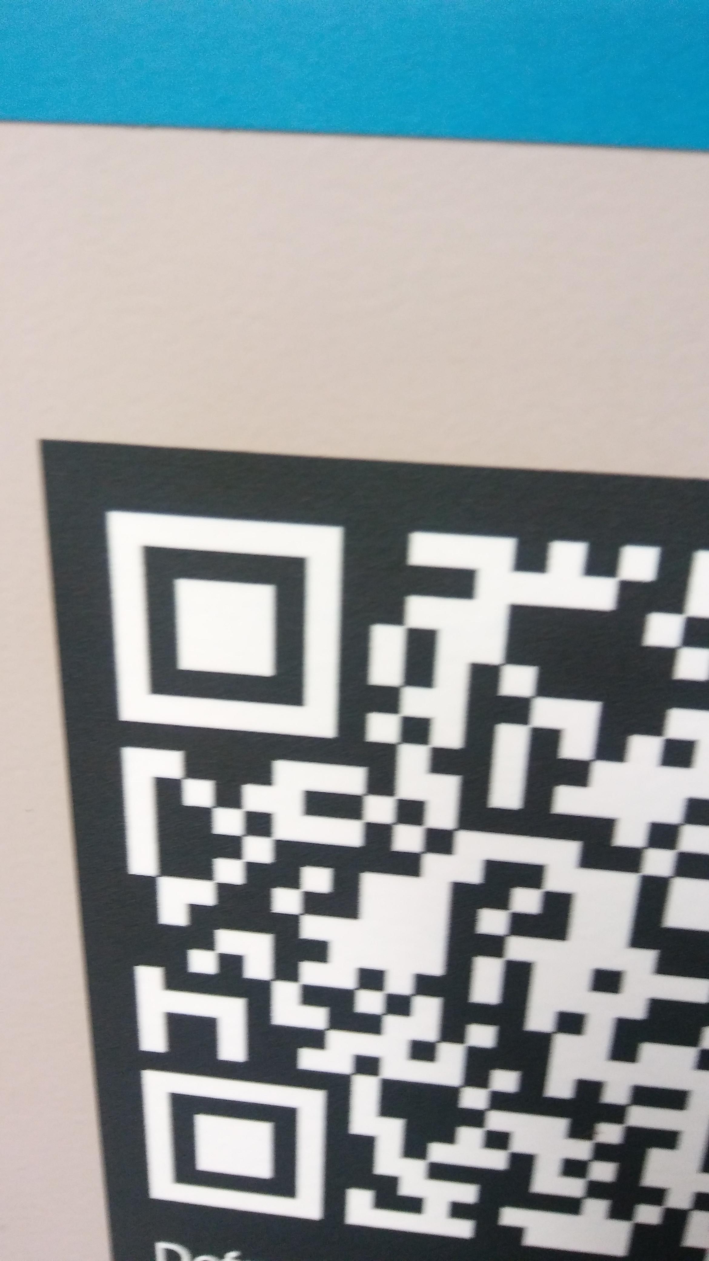Noticing this QR code earlier, the triangular shaped part in the top