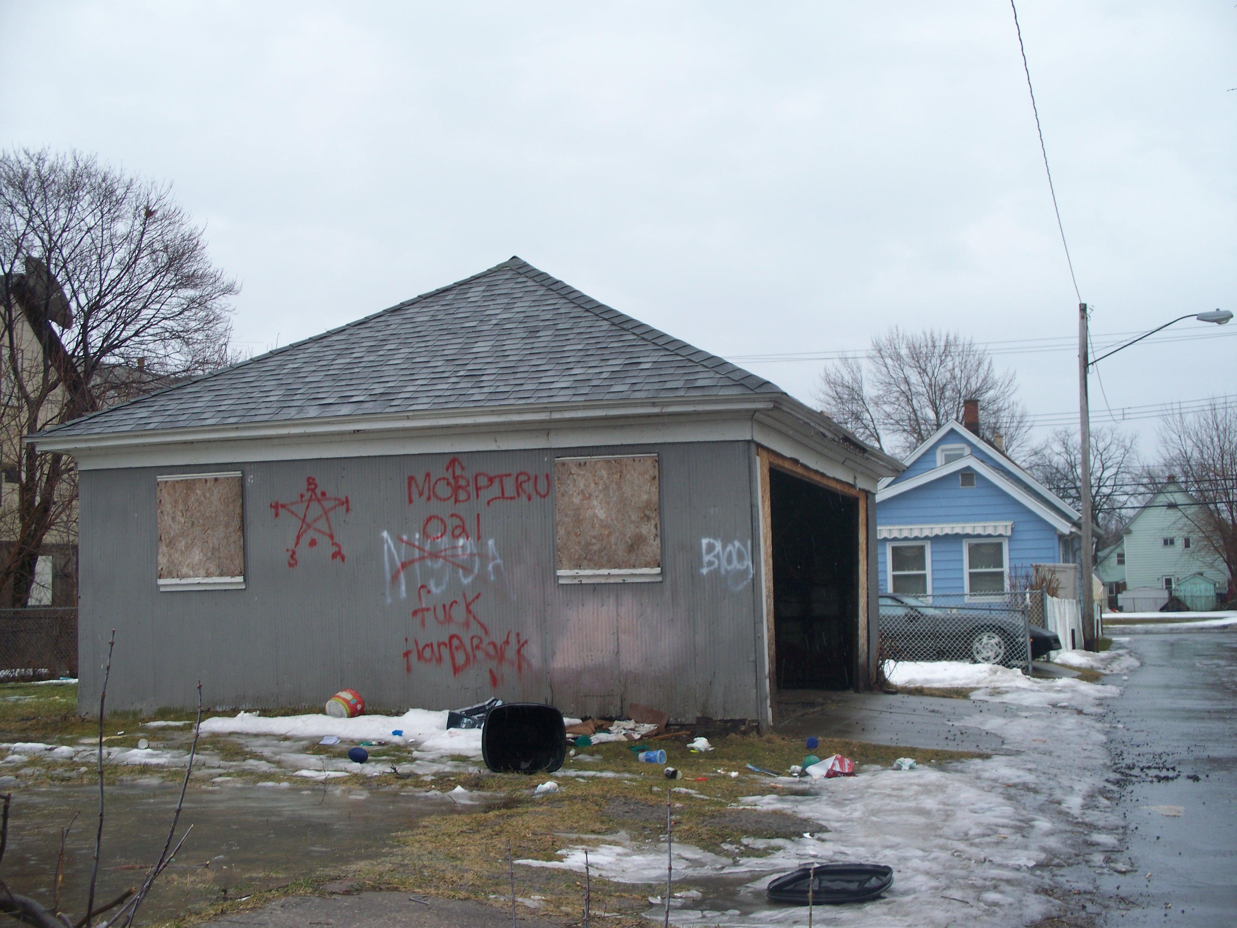 MOB PIRU Blood Gang graffiti on an abandoned garage in Niagara Falls