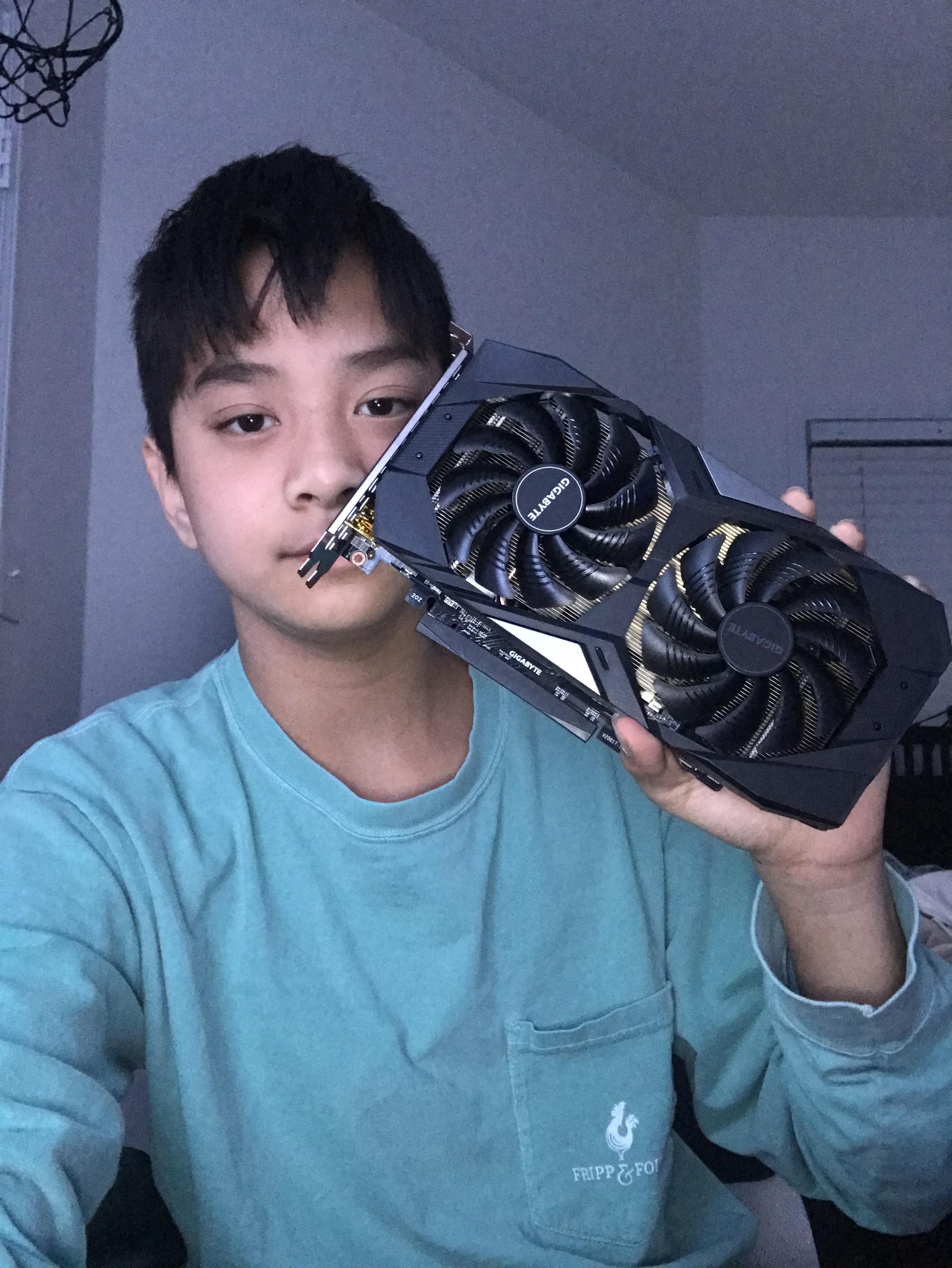 Holding my first piece off pc hardware that’s actually mine, A Rx 5500