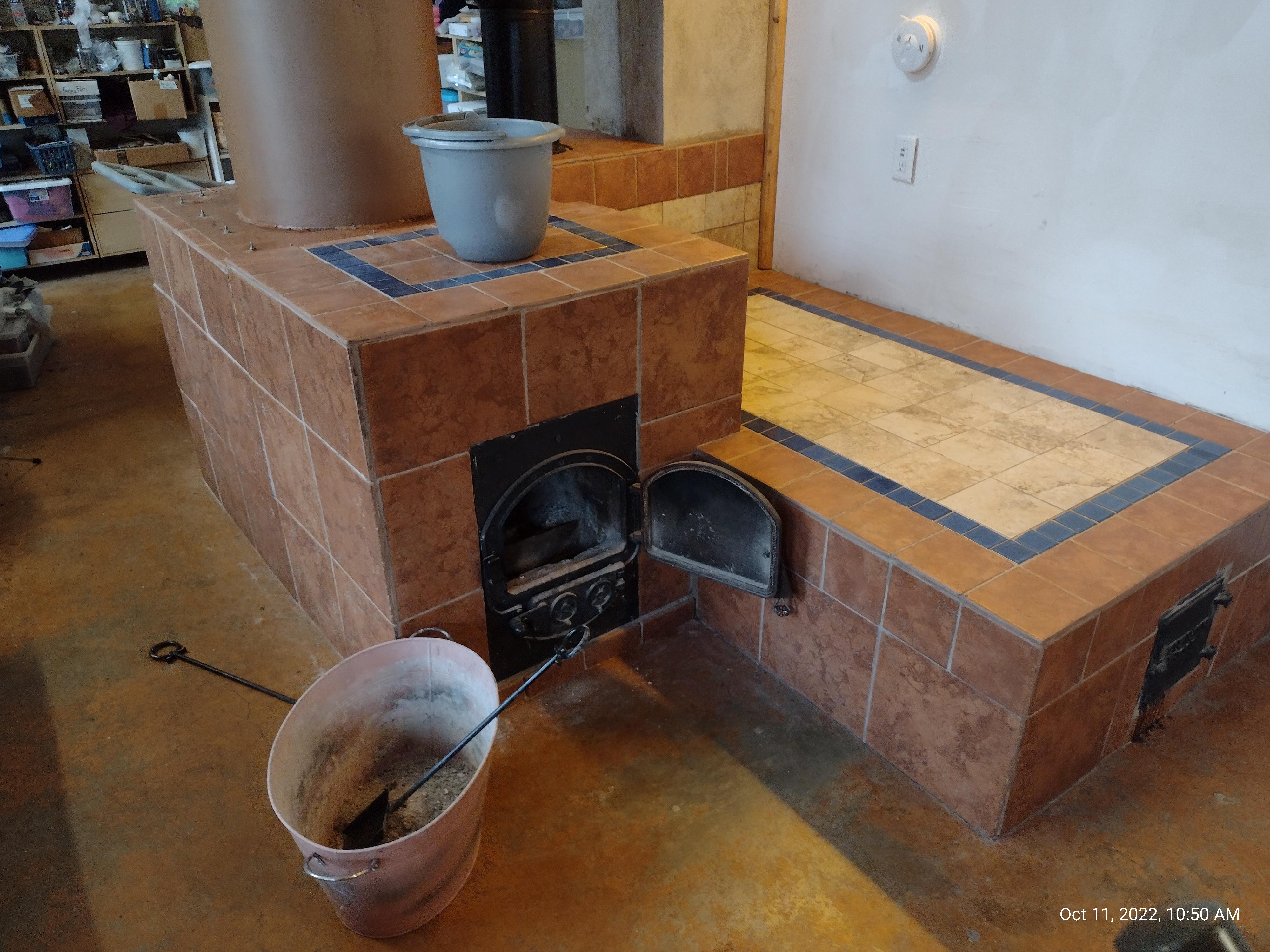 Cleaning out the rocket stove before heating season r/homestead