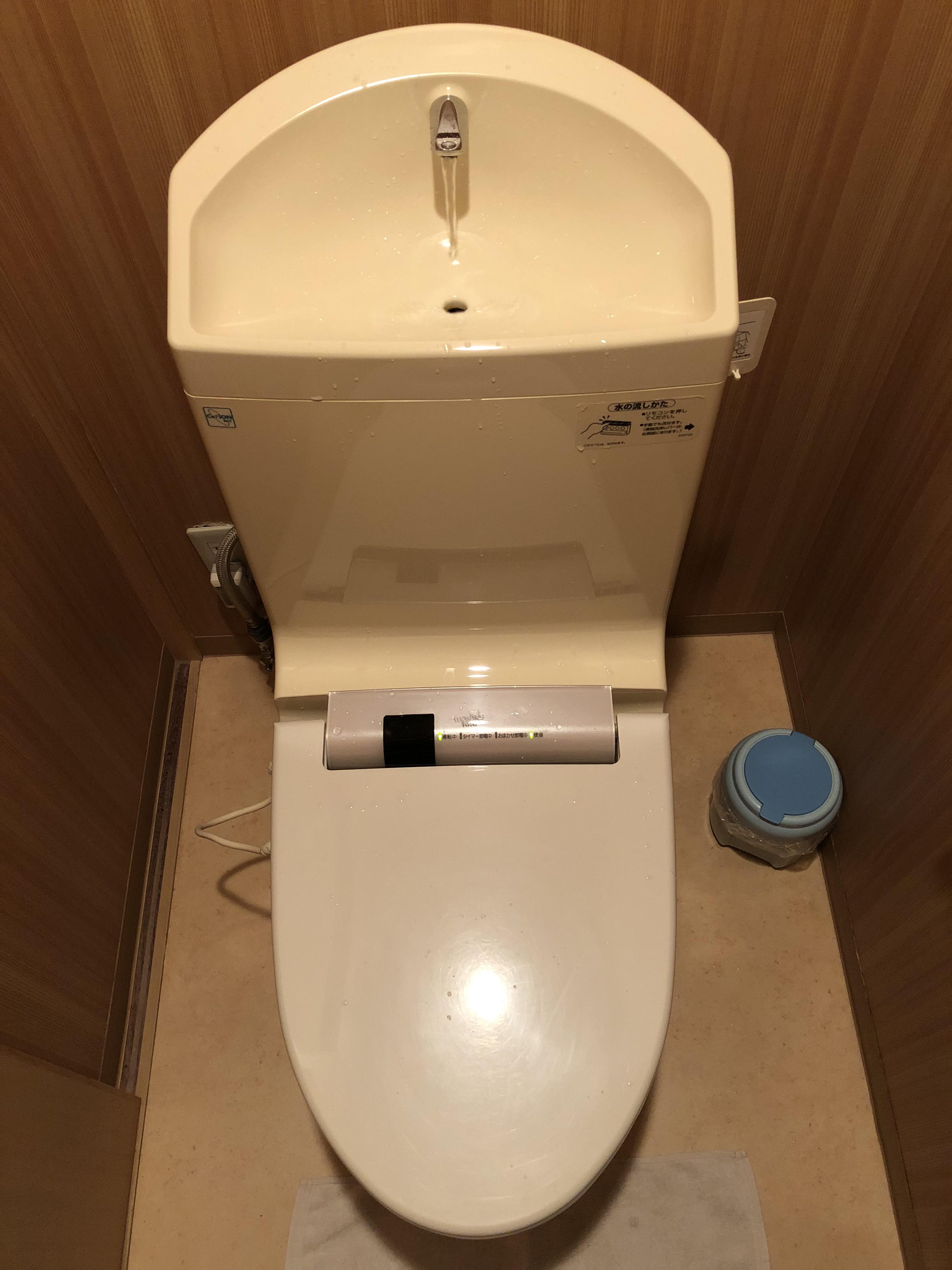 This Japanese style toilet has a faucet on top so the water you use to