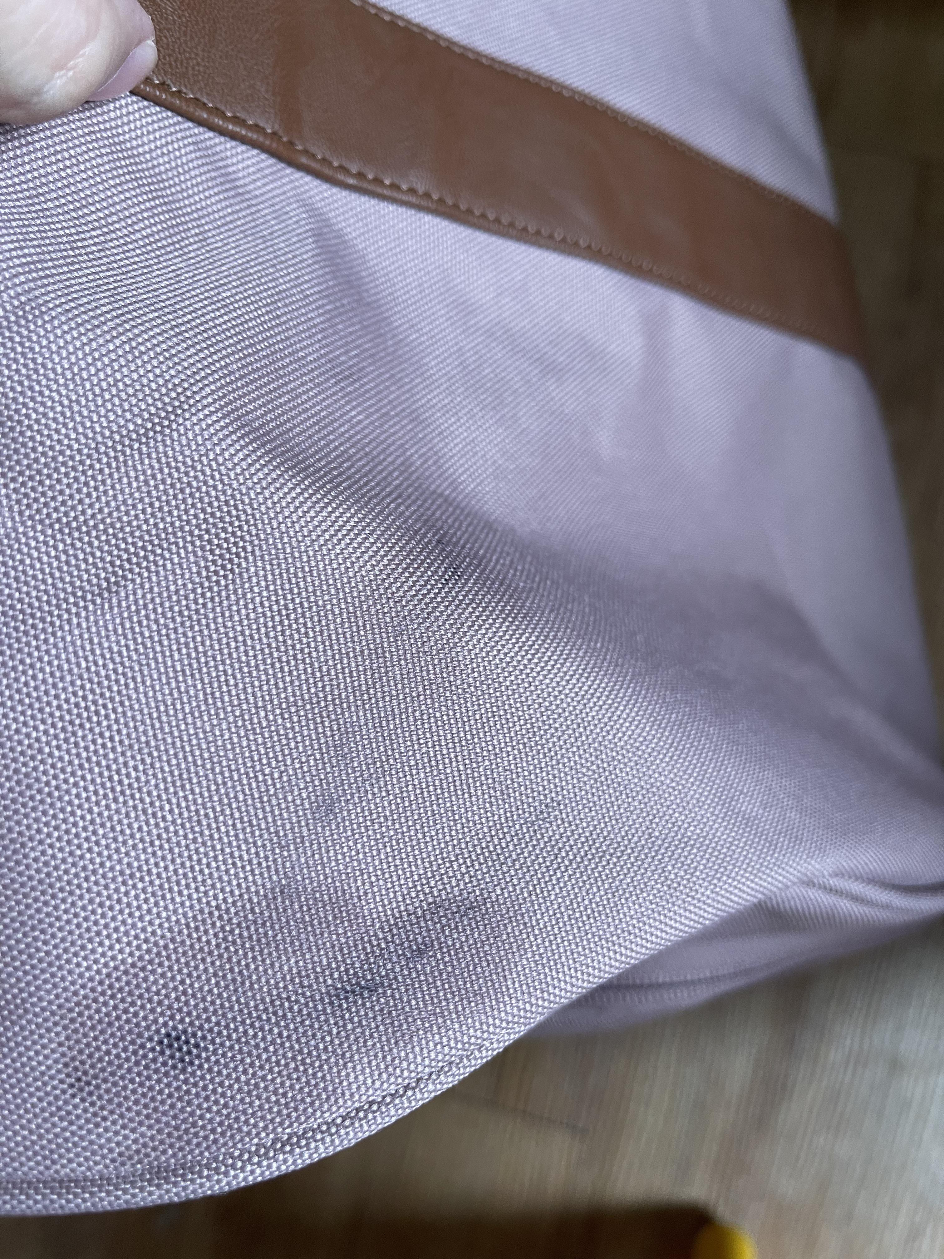 How to clean this mess from a Herschel bag? (I tried scrubbing the