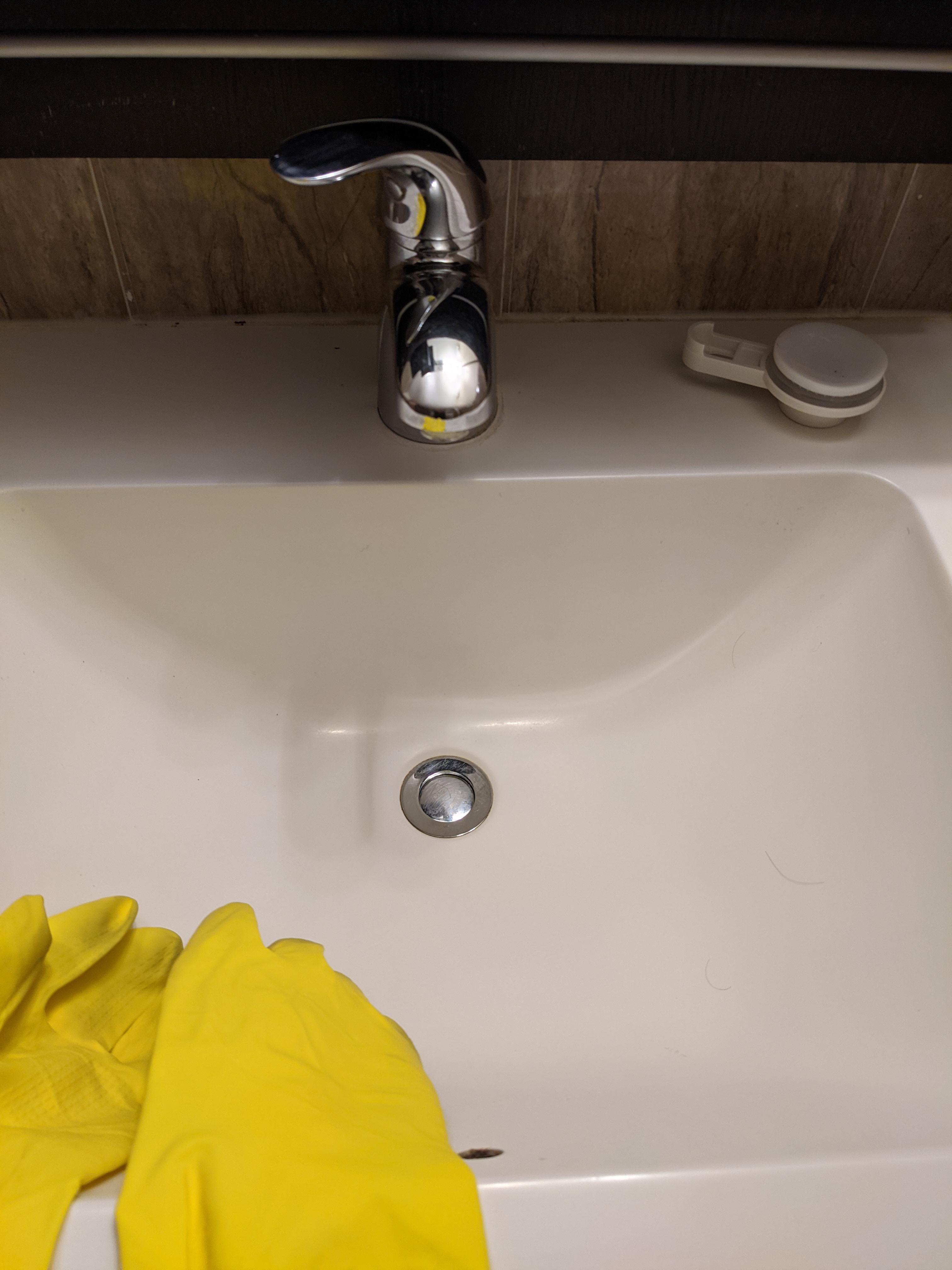 Drain Stopper jammed stuck. Any ideas how to take it out? Plumber says