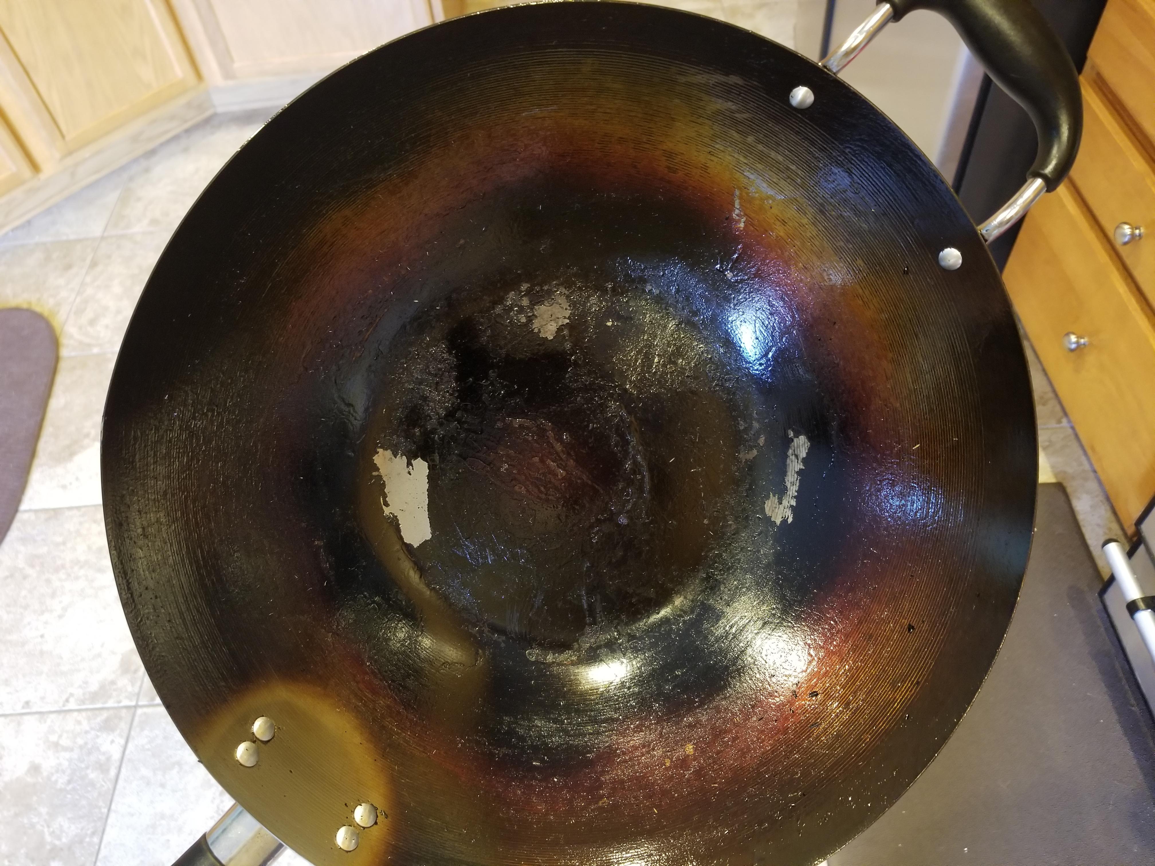 Trying to season a new wok. Bottom flaking, see pic, what'd I do wrong