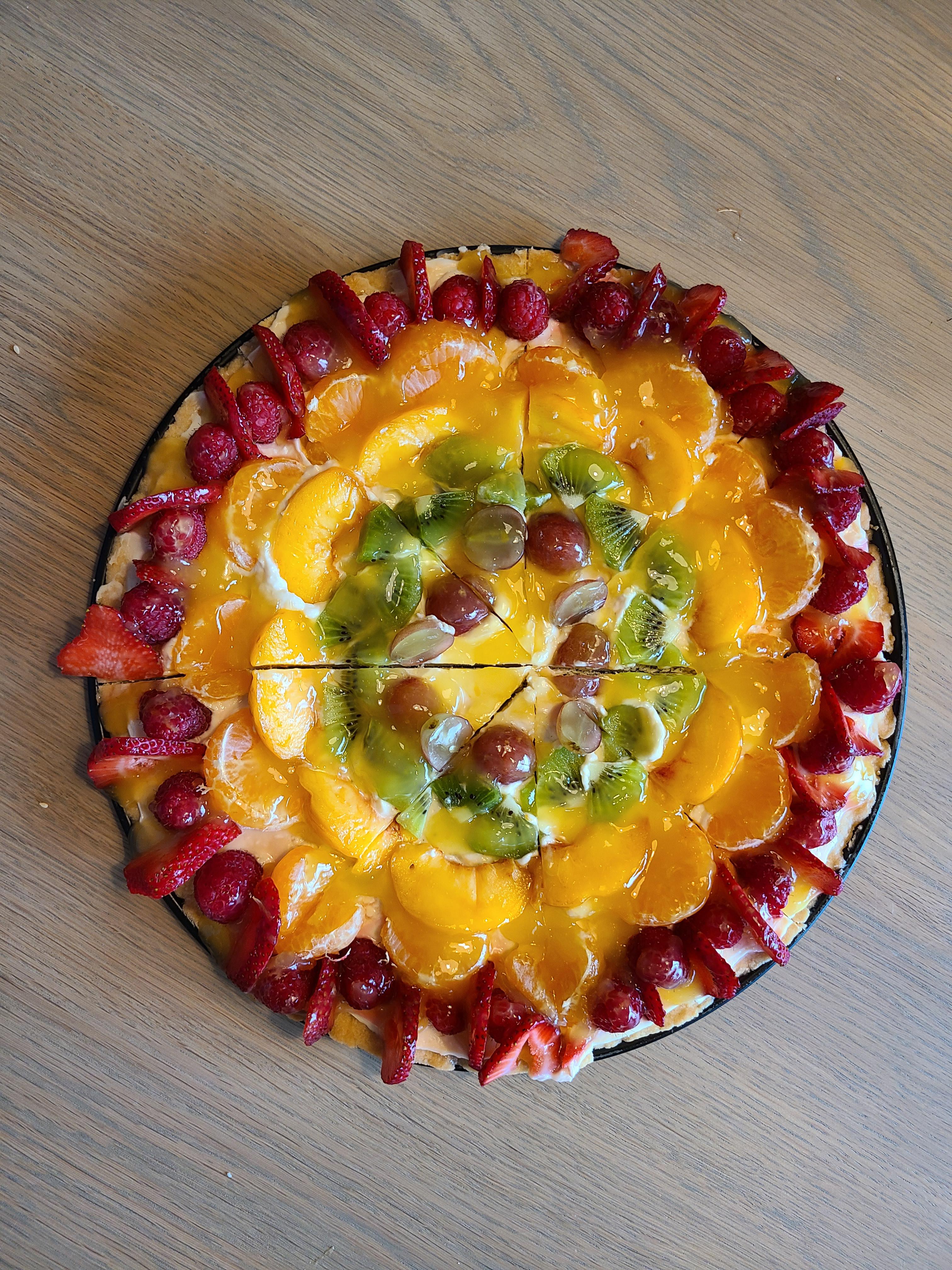 [Homemade] fruit pizza with grapes, kiwi, peaches, orange, raspberries