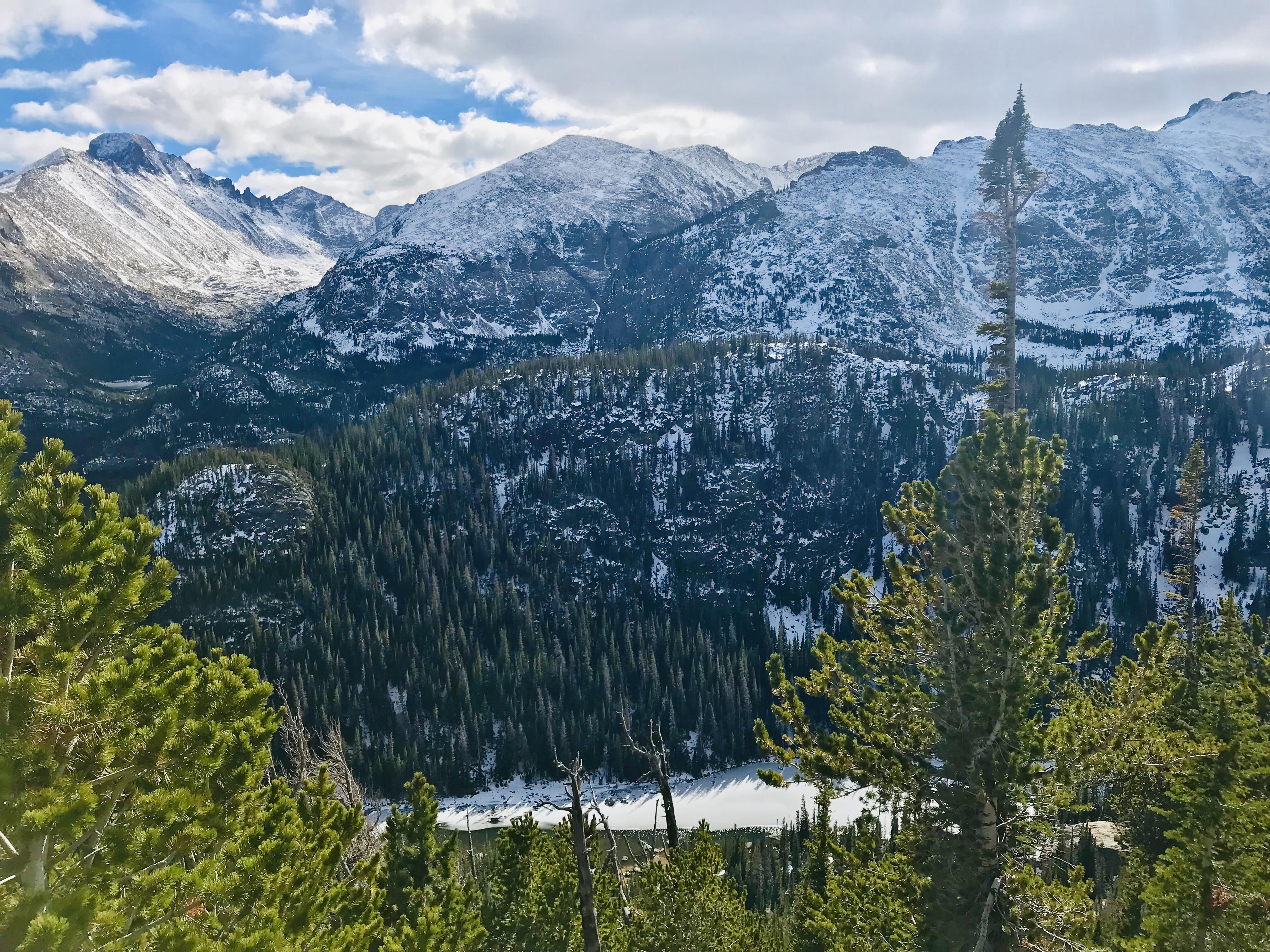 Snow Capped Peaks of the Rocky Mountains Overlooking Dream Lake [OC