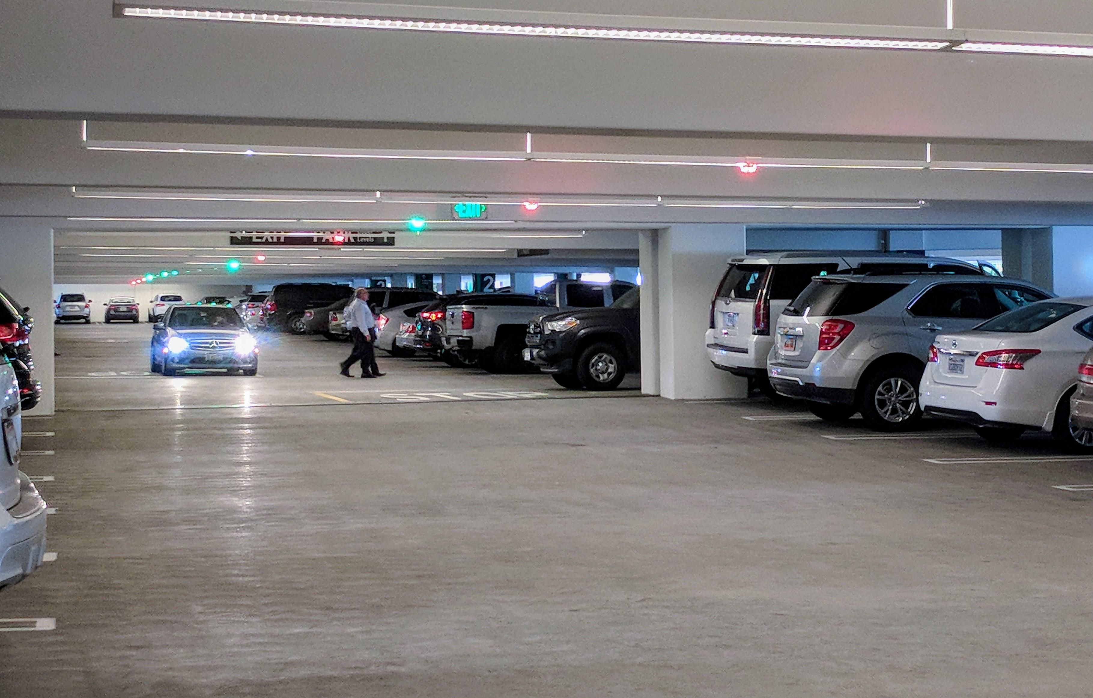 This parking garage uses green and red lights on the ceiling in each row to show you where there