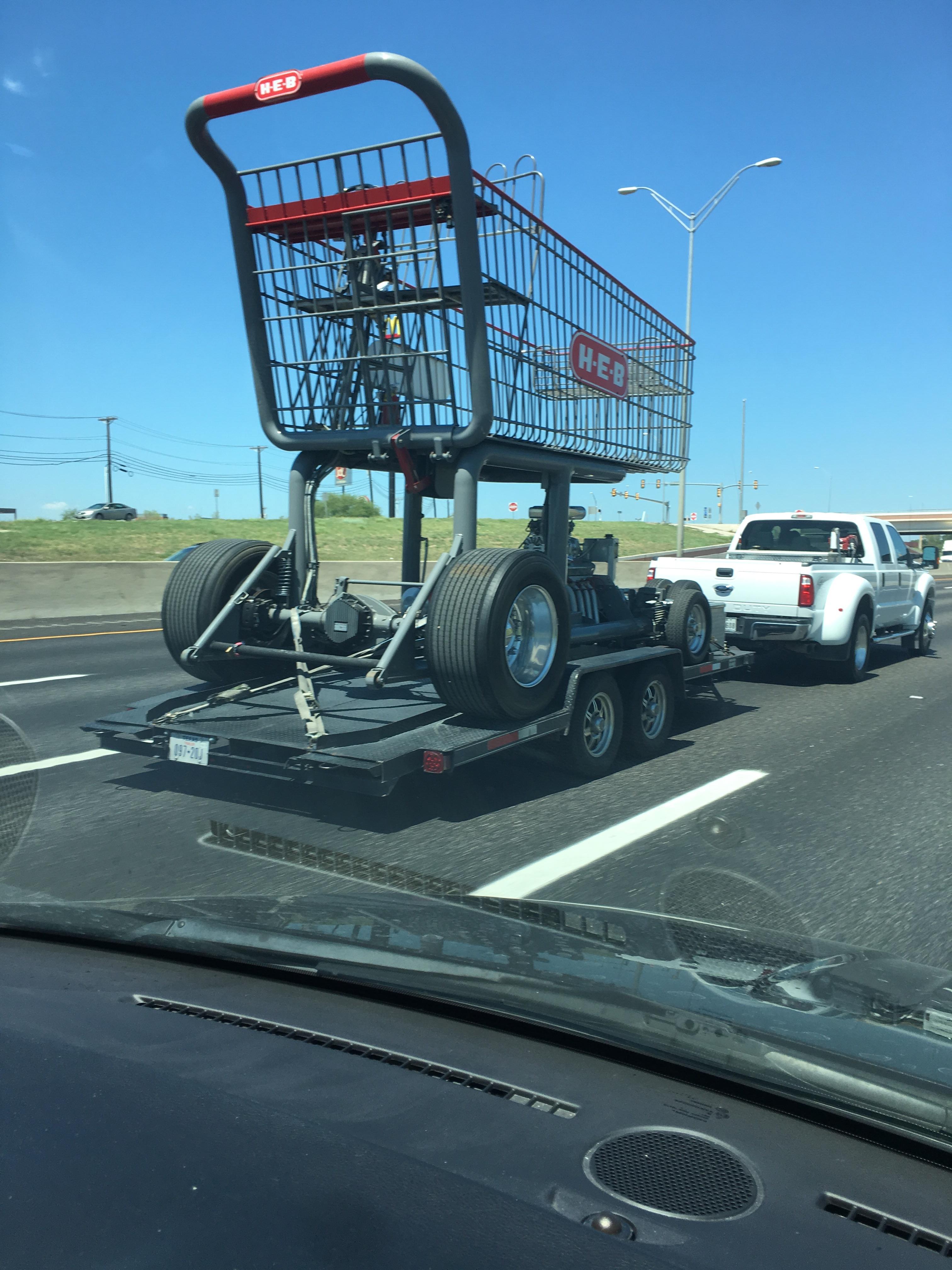 While driving to HEB, we saw this colossal HEB shopping cart. r