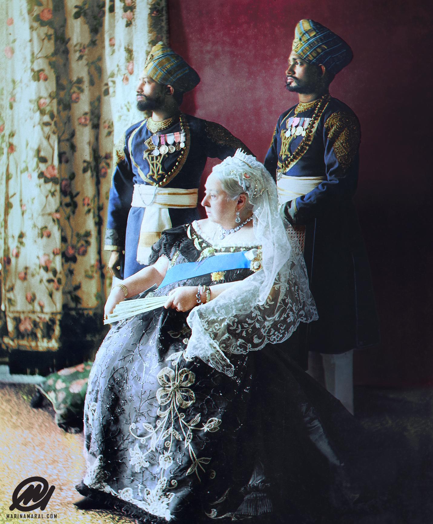 Queen Victoria seated with her two Indian servants Mustafa and Chidda standing behind her in