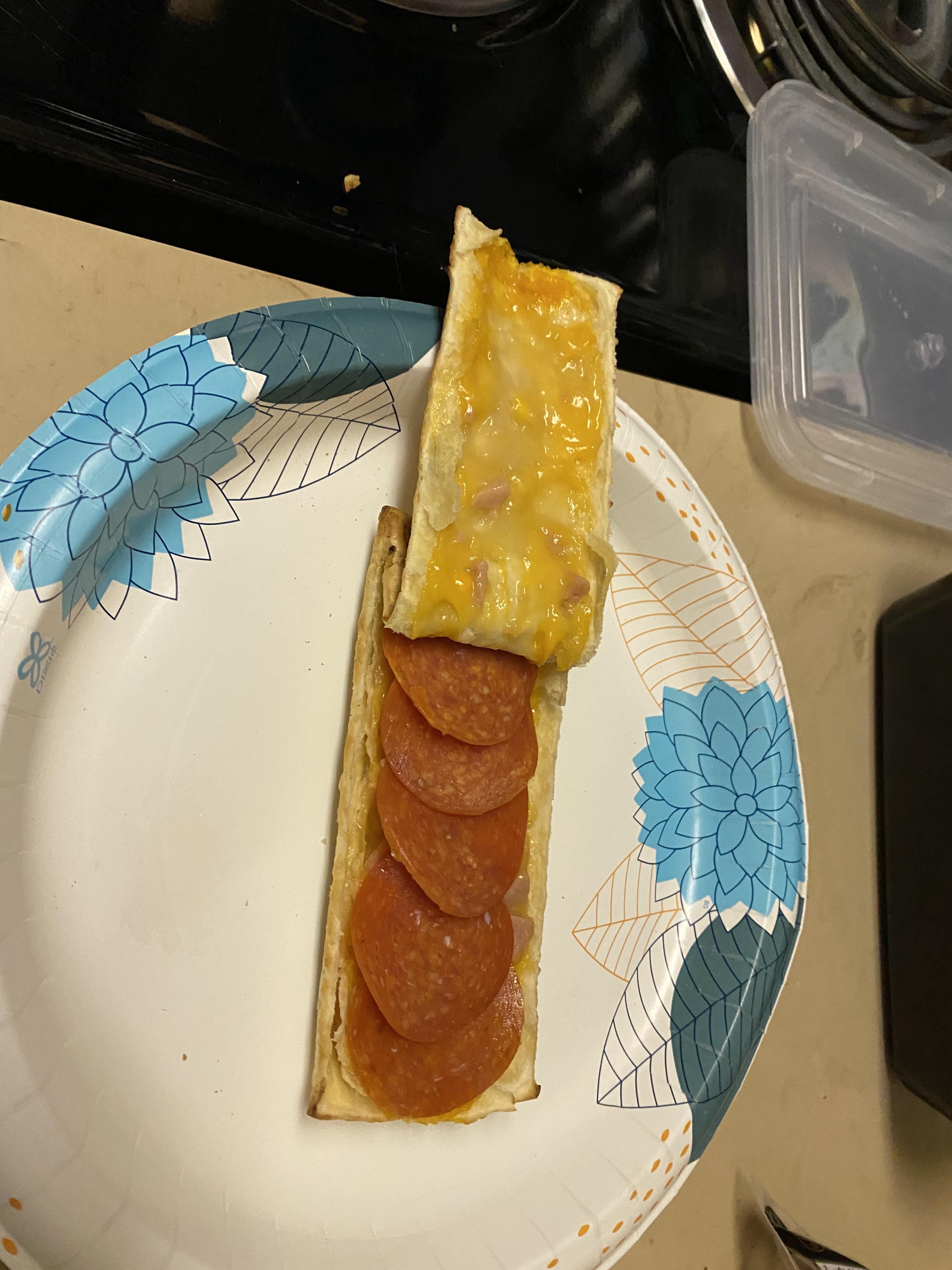 Ham & Cheese Hot Pocket with pepperoni, microwaved and served on a
