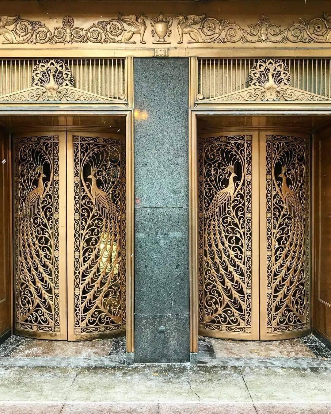 Metal worked peacock doors designed in 1925 by Tiffany for the C.D