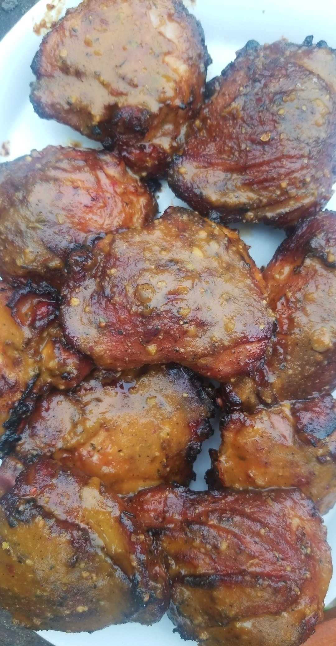 Chicken thighs marinated and sauced. r/charcoal