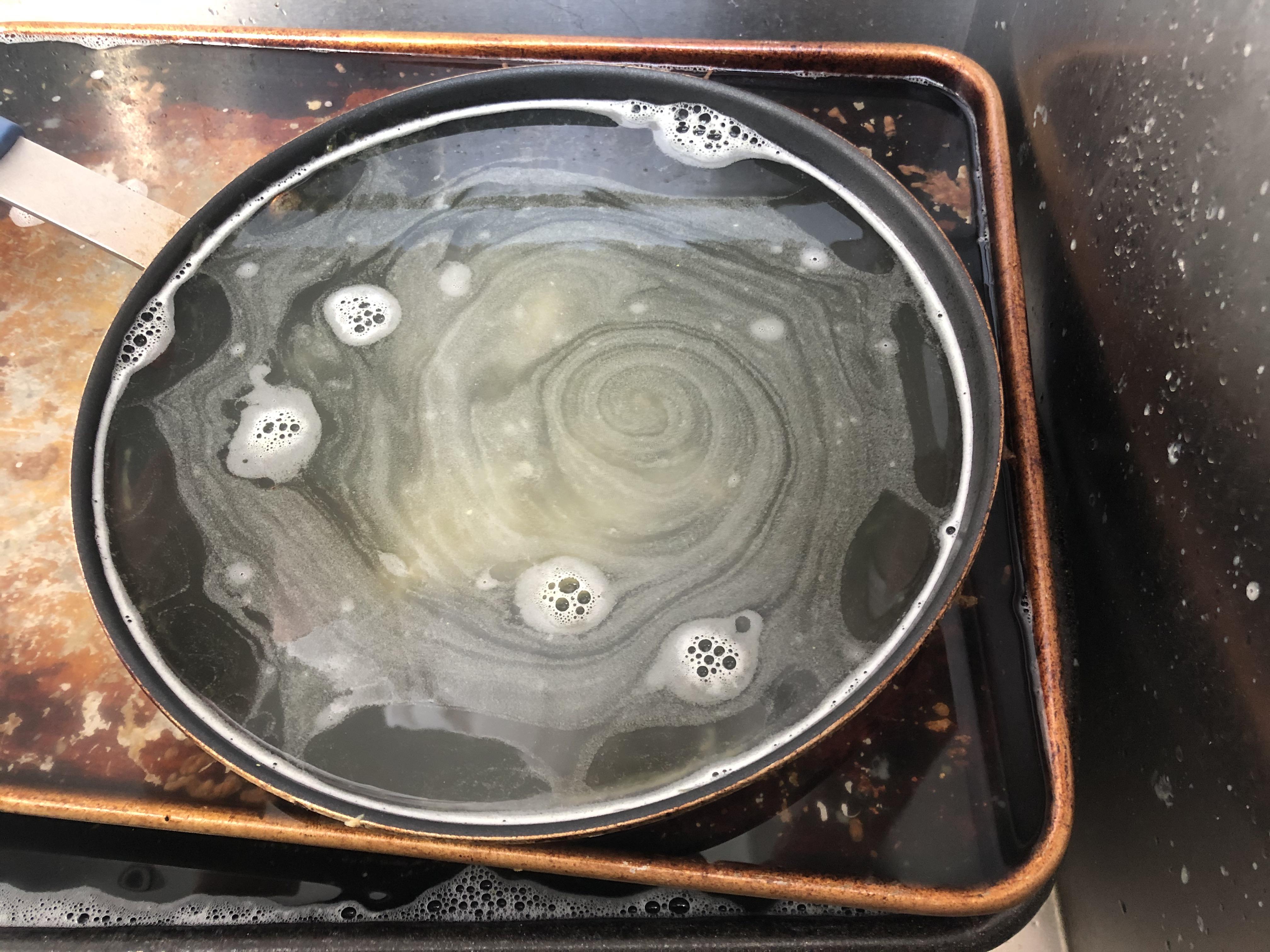 The soapy water in this frying pan looks like a galaxy when zoomedin