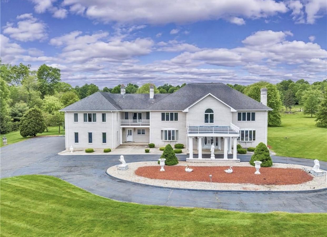 This massive 8000 square foot monstrosity has been on/off the market