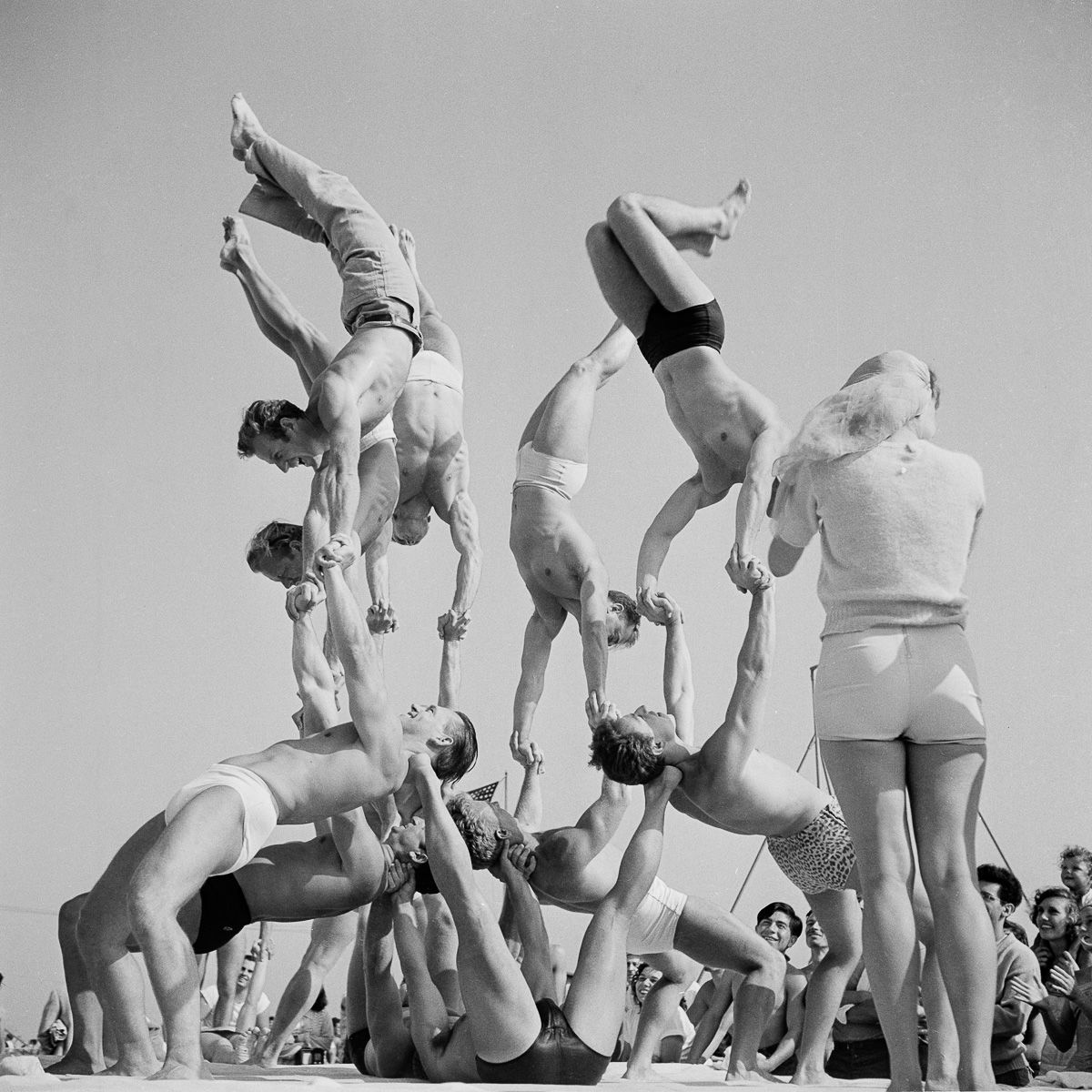 Muscle beach, Santa Monica, 1930's. Showing of strength and balance