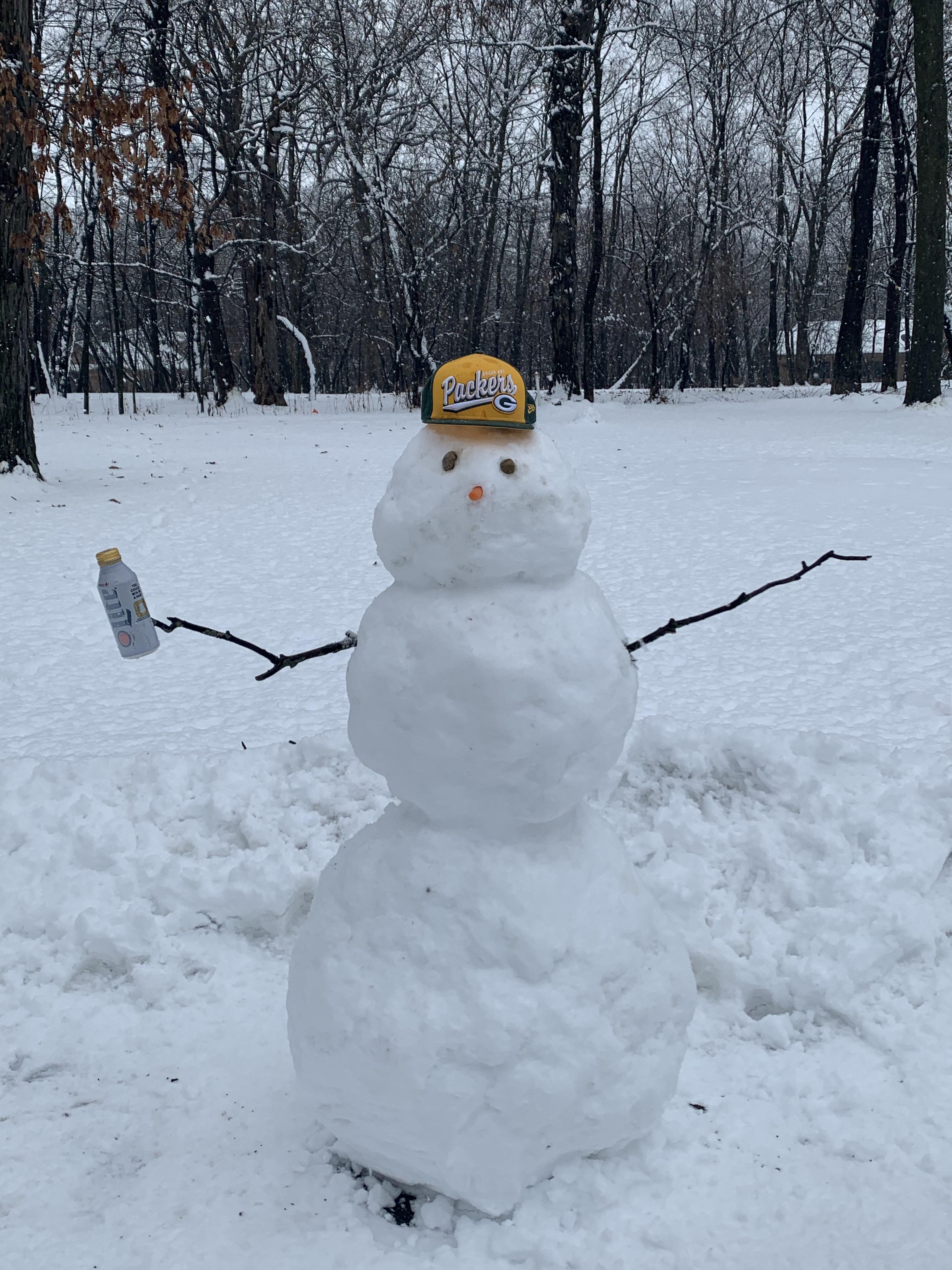 Our Wisconsin snowman my fiancée and I built r/GreenBayPackers