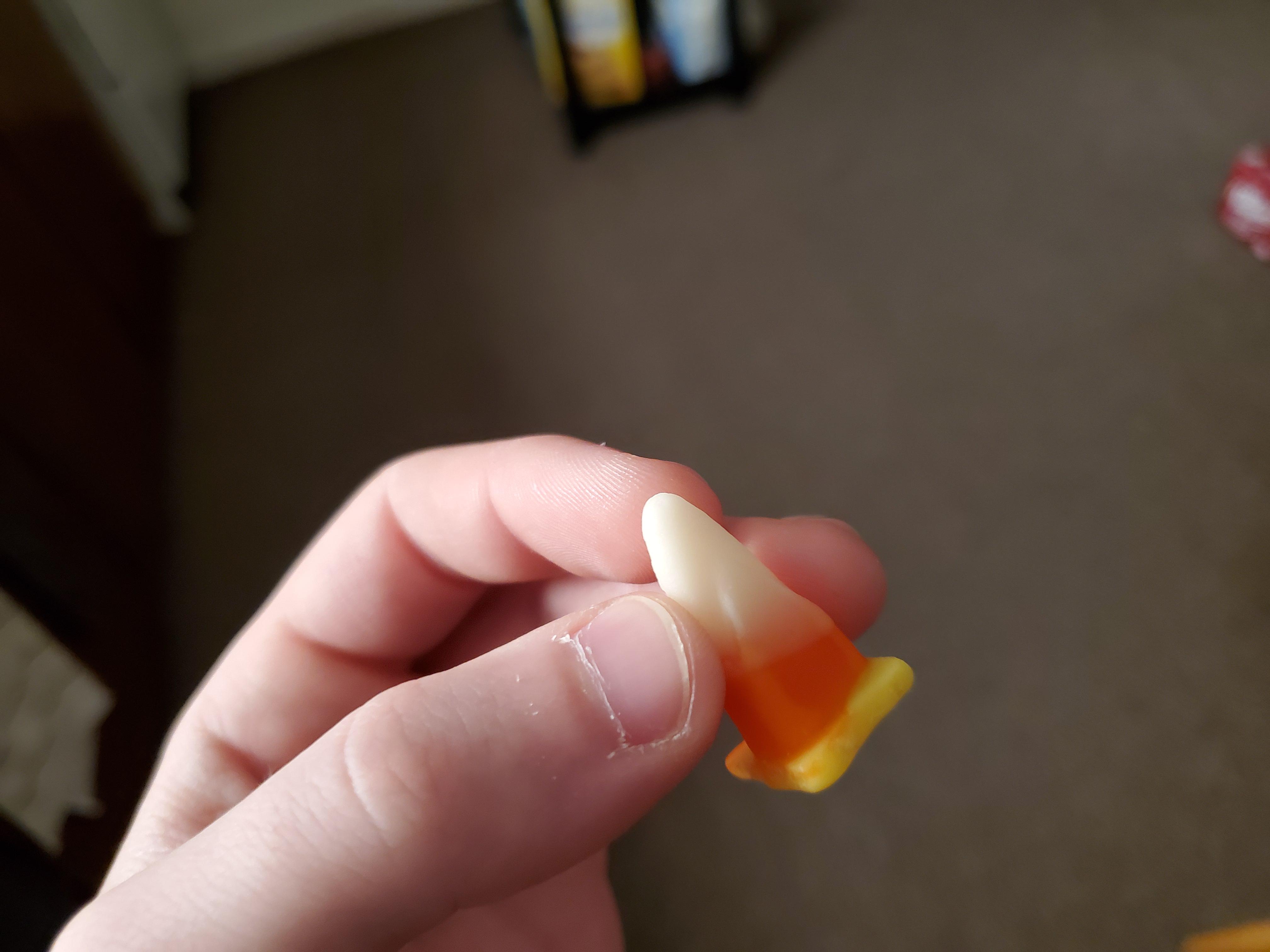 A deformed piece of candy corn came out looking like a traffic cone r