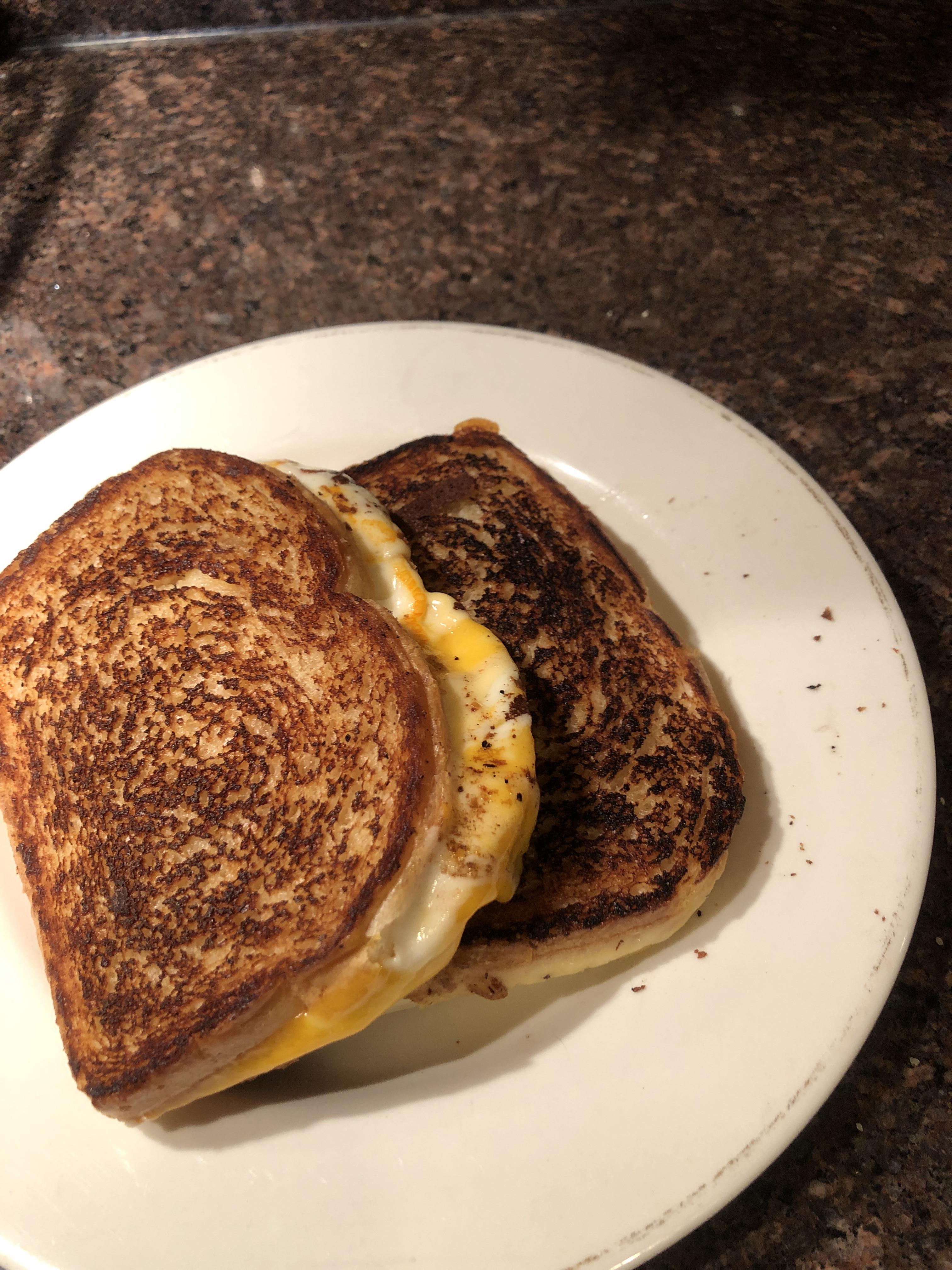 Two 3cheese (cheddar, Munster, and Gouda) on sourdough grilled cheeses