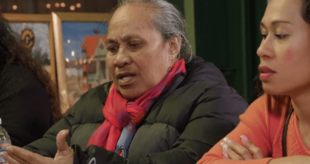 Asuelu's mother looks like she's got her line written on her hand "How much money... *looks at