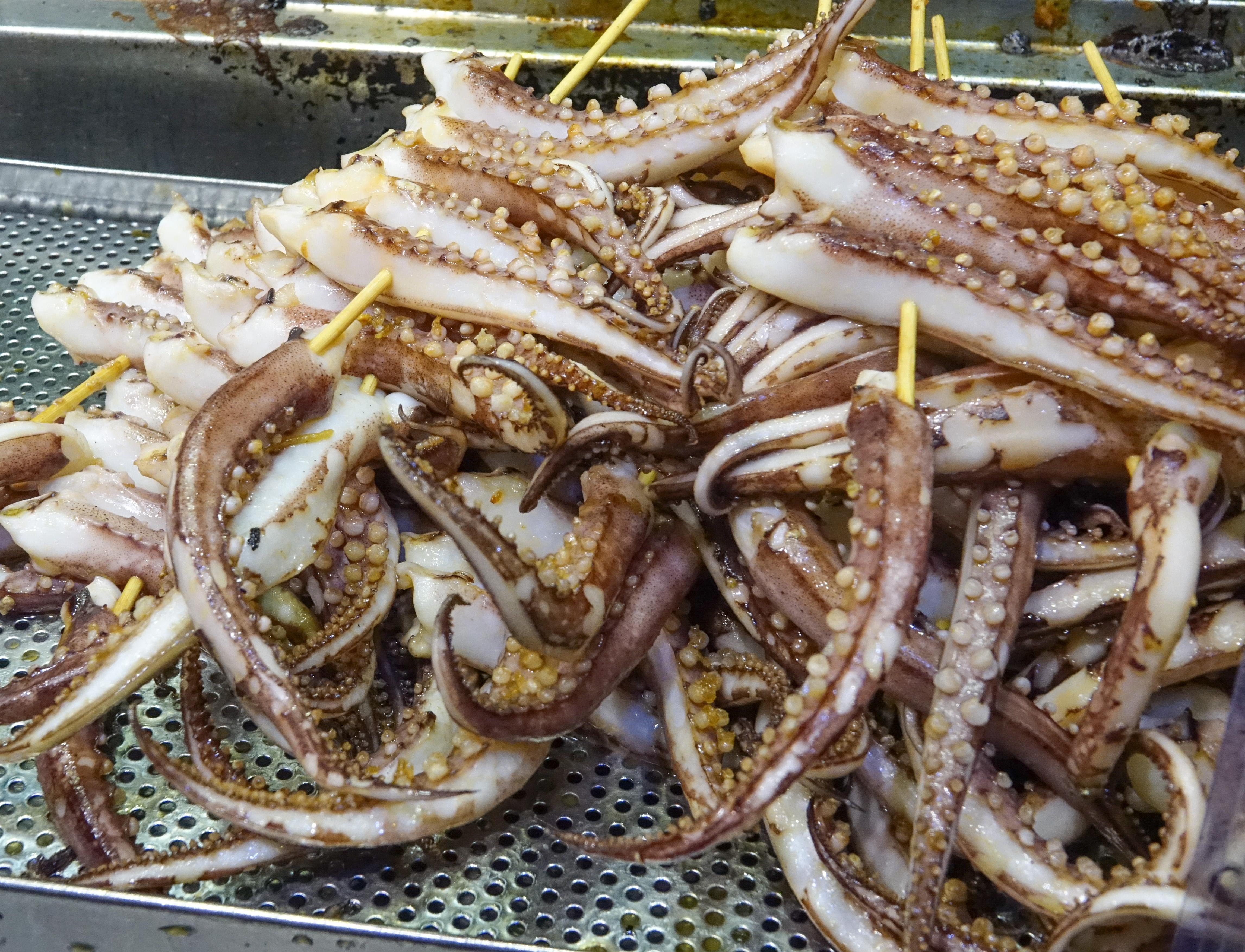 Snacks of grilled octopus legs. Seen in Mong Kok, Hong Kong [4587x3508