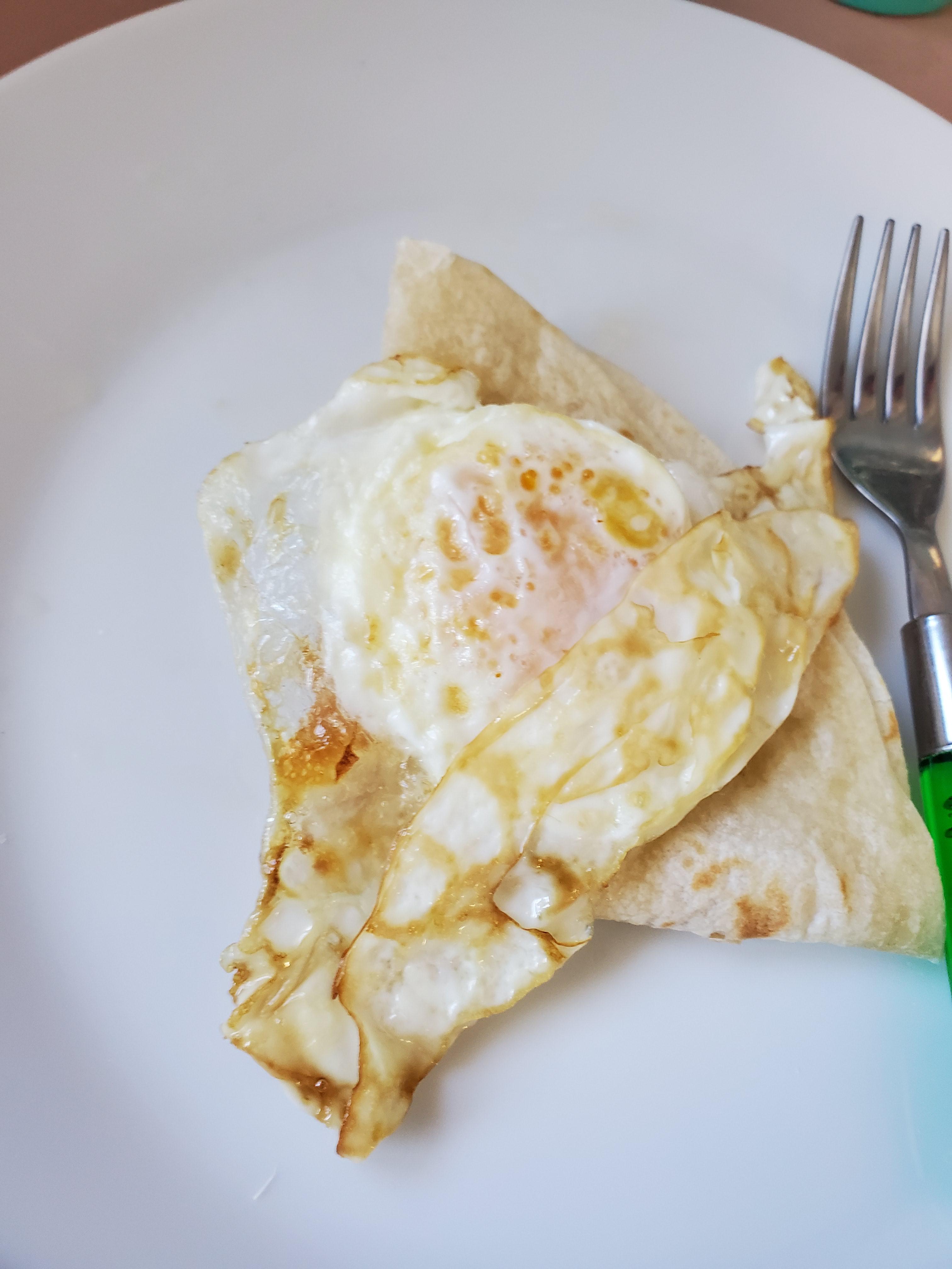 Fried egg on a tortilla with cream cheese inside. So good I had it for