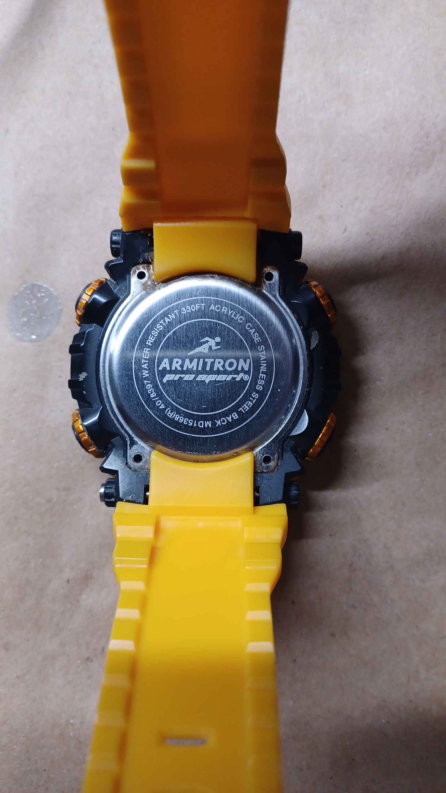 Trying to replace battery on Armitron Pro Sport watch but wrist band is holding it down and I'm