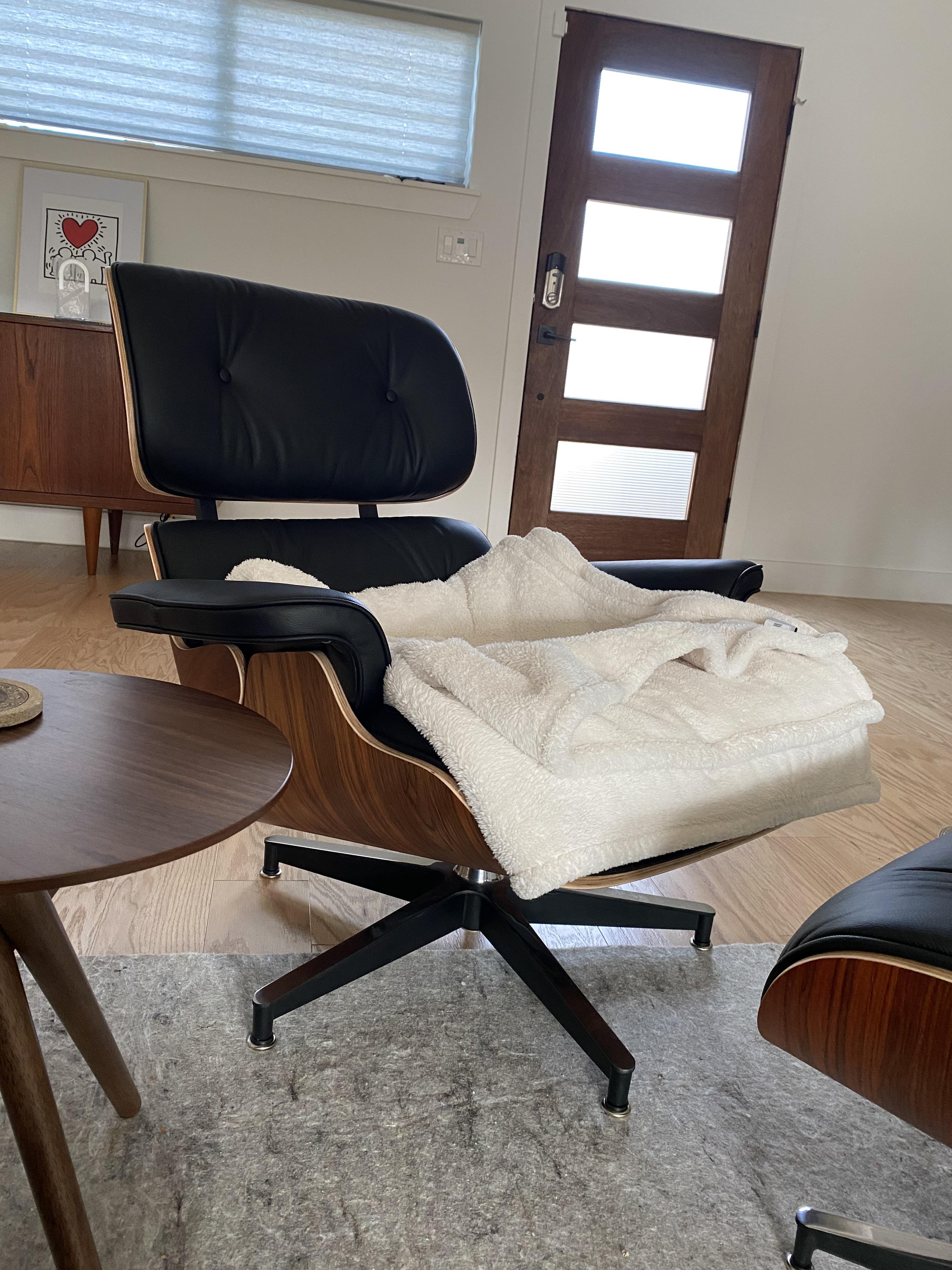 Has anyone found a way to raise the seat height on an Eames Lounge